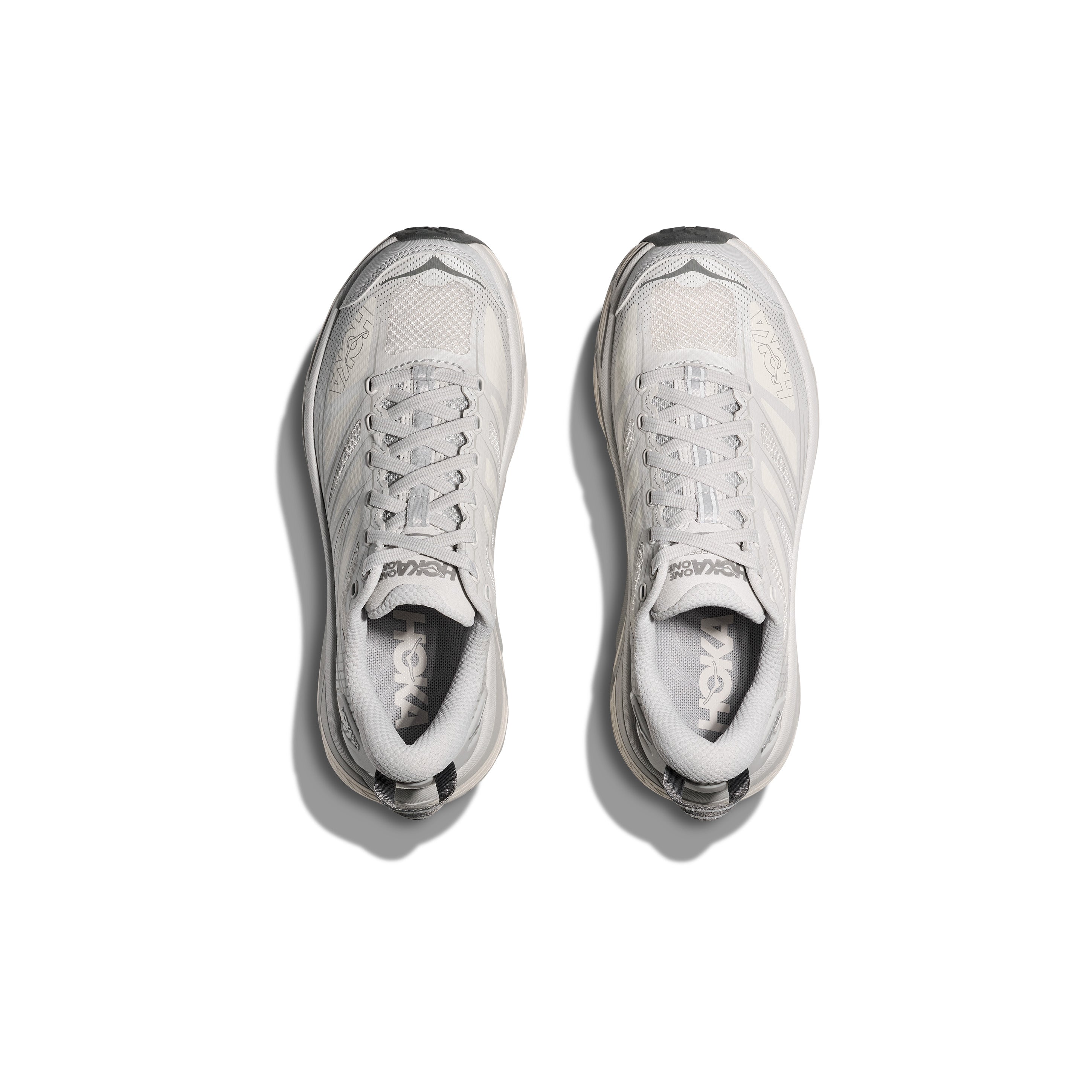 A pair of Hoka U Mafate Speed 2 trail running shoes in Cosmic Grey/Alabaster, seen from above and placed side by side on a white background.