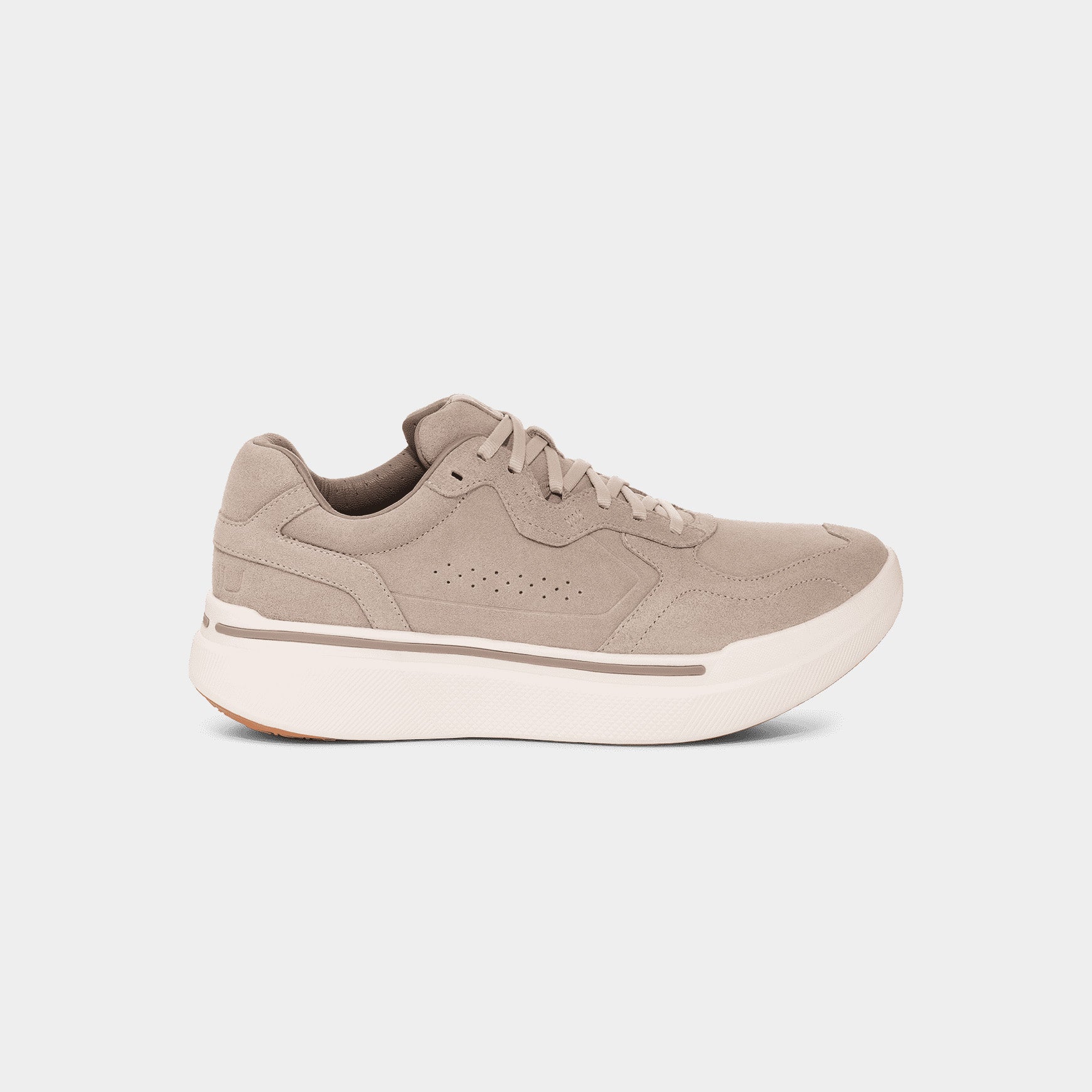 The AHNU M Sequence 1.1 Suede is a tan sneaker featuring a thick white sole with premium foam, lace-up design, and perforated side details for a modern look, shown from the side against a plain backdrop.