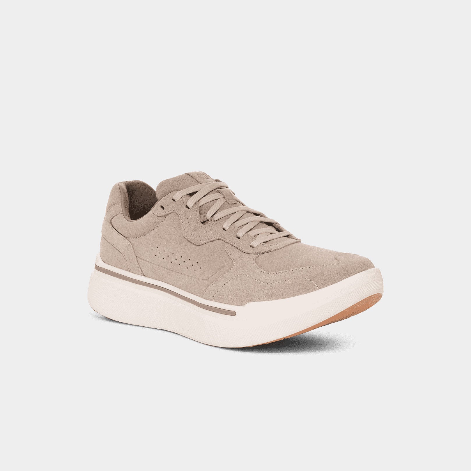 The AHNU M Sequence 1.1 Suede sneaker features a beige suede upper with perforations, tan accents, and a thick white sole. Enhanced with a premium foam midsole, it ensures ultimate comfort.