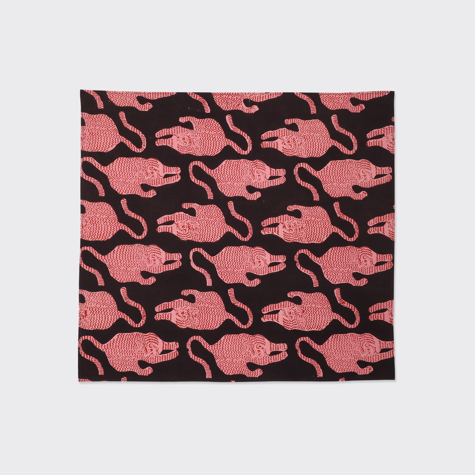 The Kardo Bandana 21" x 21" in Coral features a block print design with a repeating pattern, crafted from high-quality fabric.