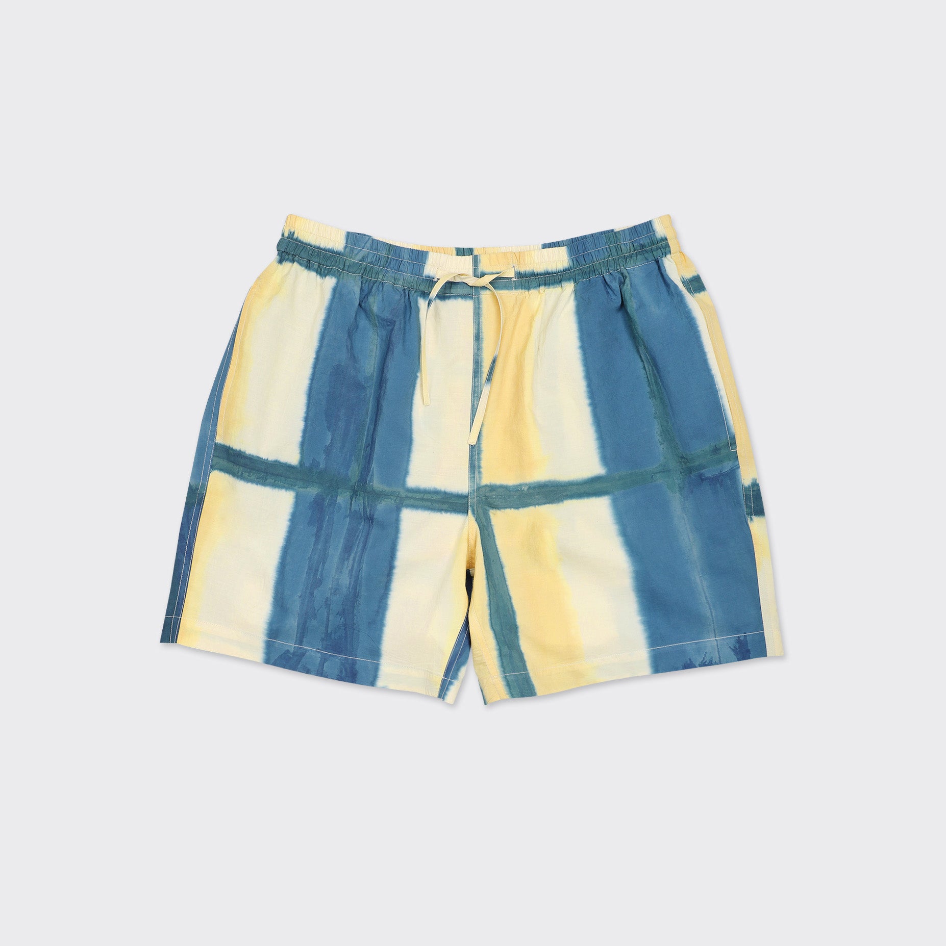 The Kardo Olbia Shorts feature an elastic waistband with drawstring and showcase a yellow clamp dye pattern.