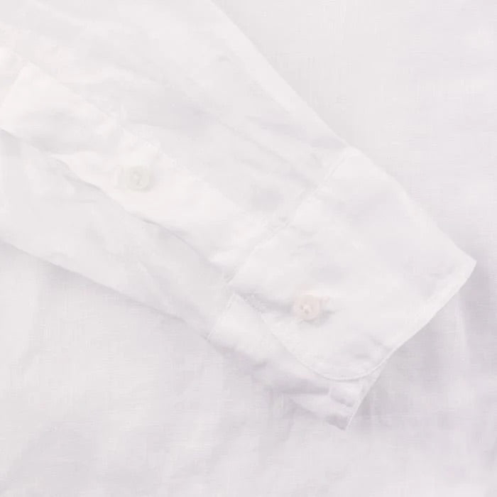 The Gitman Vintage White Linen Shirt features a long sleeve cuff with two buttons, shown laid flat on a white surface.