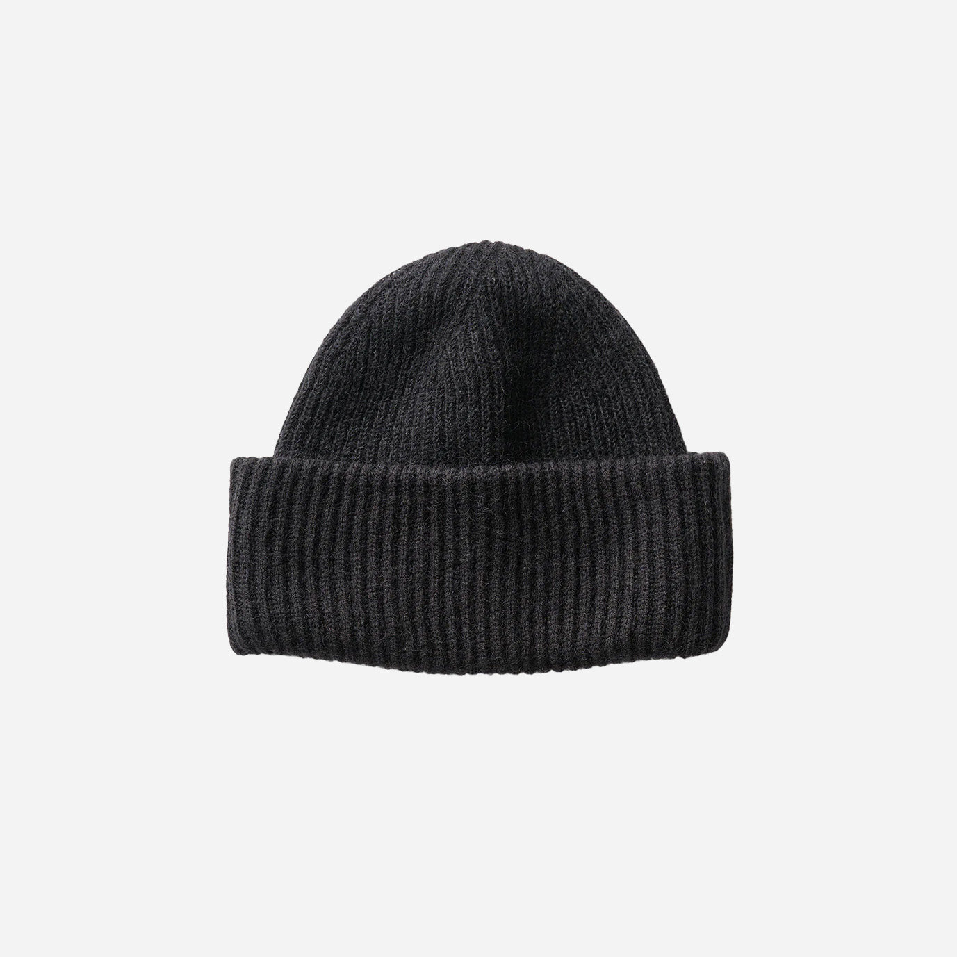 The Holden Wool Beanie in black, a wool blend knitted hat with a folded brim, is centered on a white background.