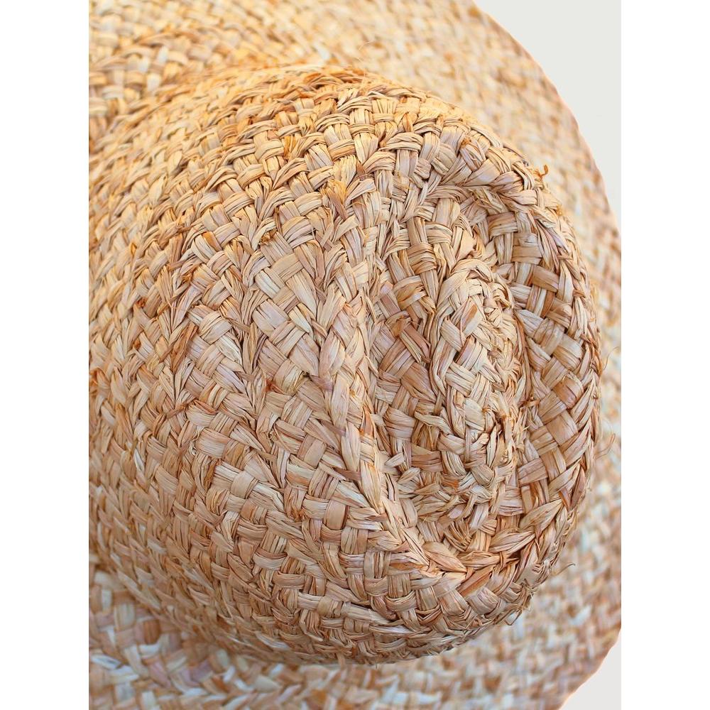 Close-up of a Lola Hats Fiscolo, Natural showcasing the detailed woven texture, focusing on the spiral pattern at the crown.