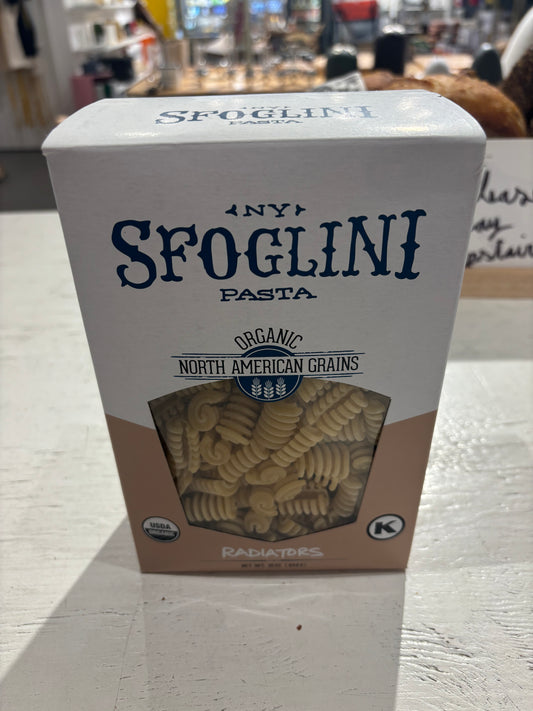 A box of Westerlind organic radiatori pasta made from north american grains, placed on a store shelf.