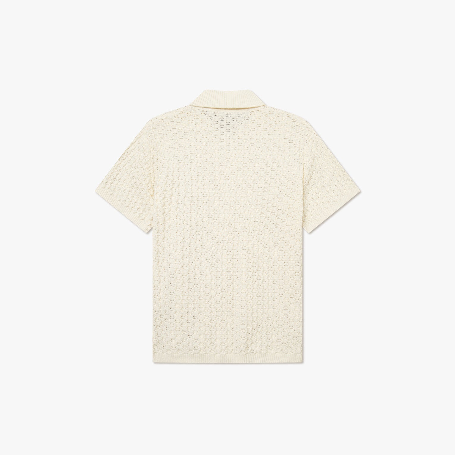 Back view of the Gespertus SS Knit Shirt by Les Deux, a cream short-sleeve shirt made from organic cotton with a textured knit pattern and ribbed collar, shown on a plain white background.