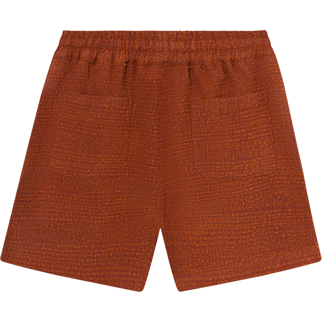 Kevin Boucle Shorts in Court Orange by Les Deux, with a comfortable stretchy waist and side pockets, displayed on a plain white background.