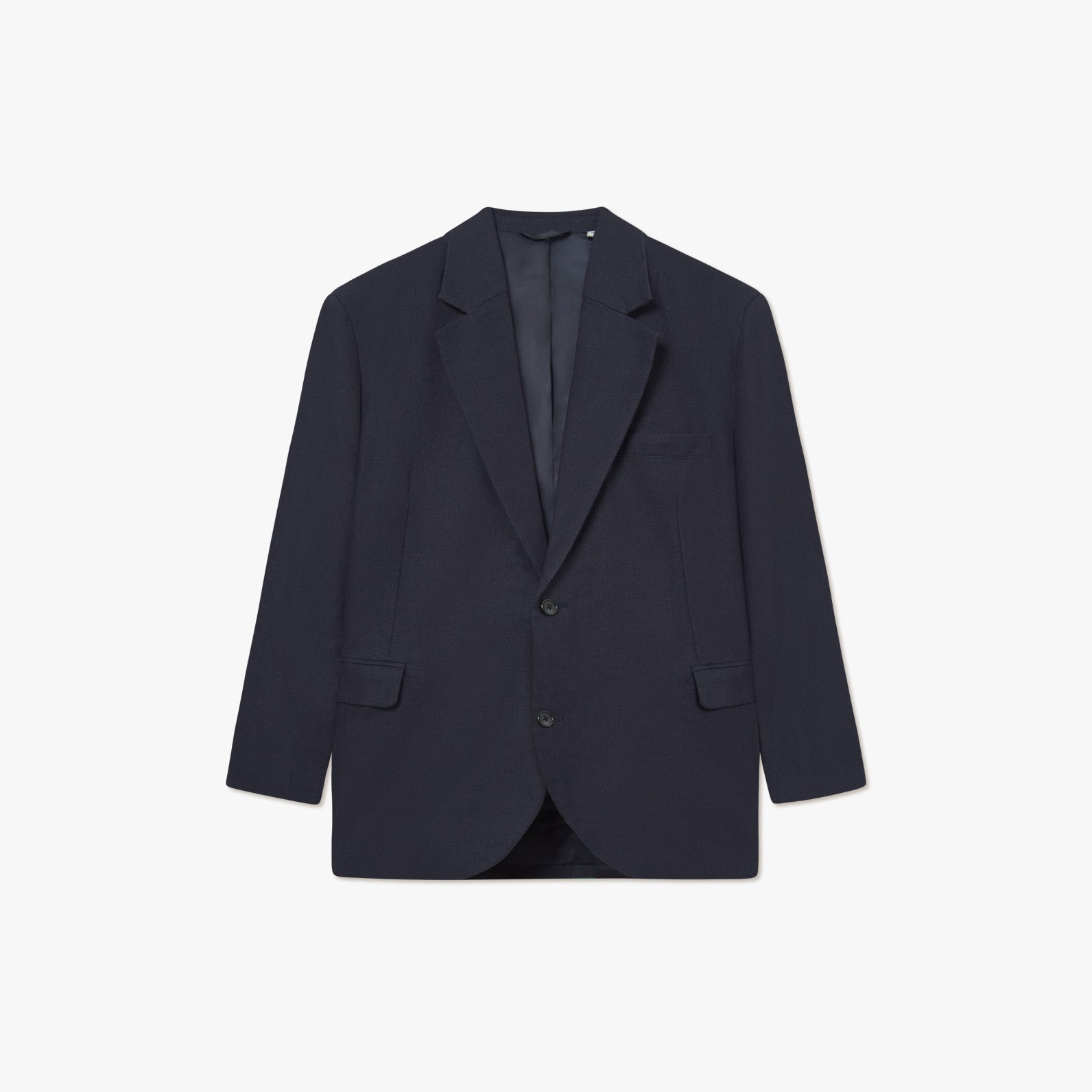 The James Linen Blazer by Les Deux is a single-breasted, dark navy loose fit blazer with two buttons, notched lapels, and two front flap pockets—perfect for warm weather—shown against a white background.