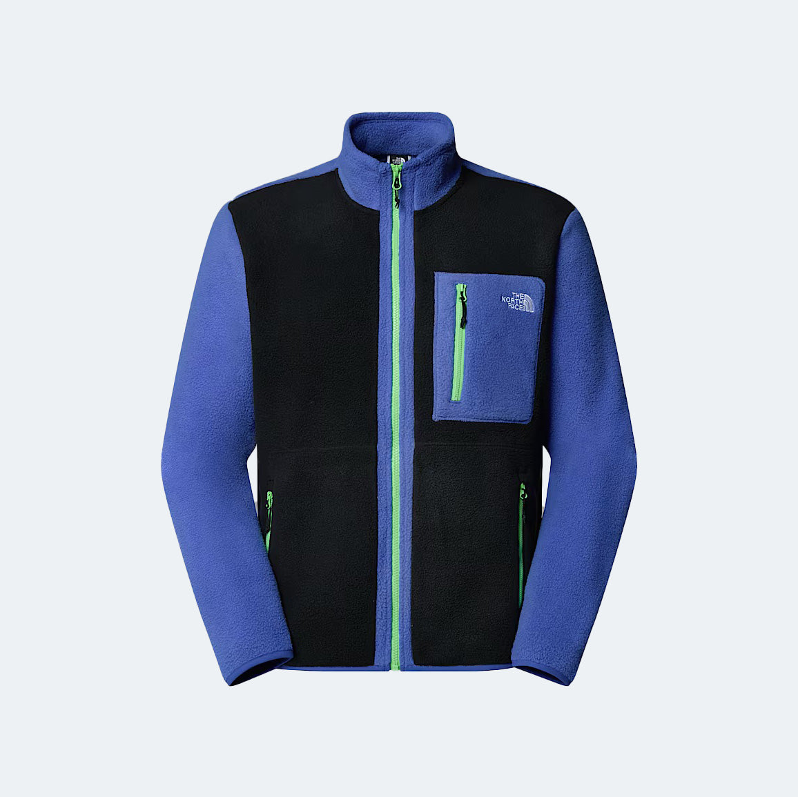 The North Face M Yumiori Full Zip offers reliable warmth with green zippers, a small left chest pocket, and midweight fleece in blue and black—perfect for layering.