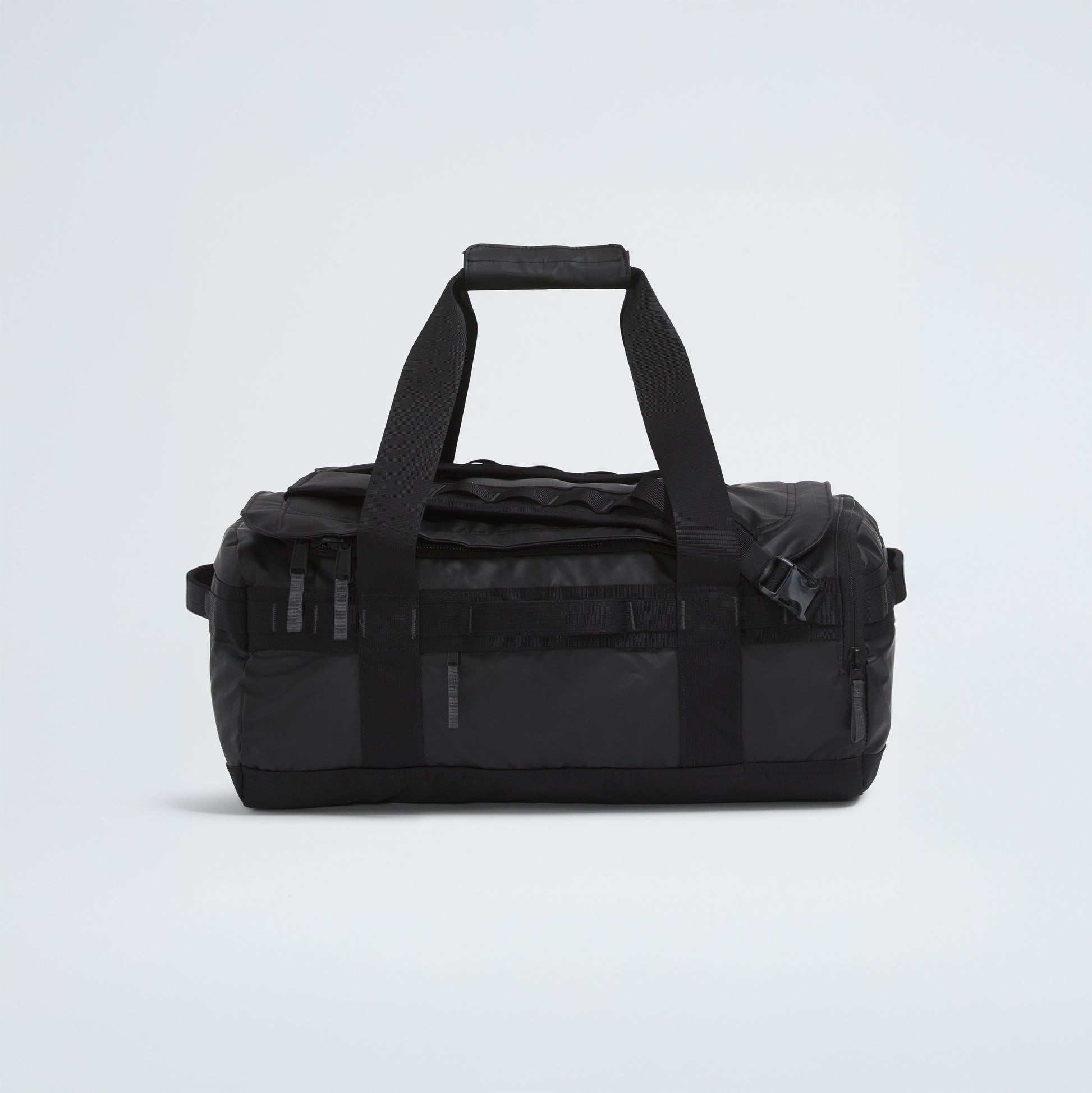 The North Face Base Camp Voyager Duffel - 42L, in black, features dual handles, zippered pockets, and a rectangular shape—an ideal lightweight choice for your next trip, shown against a plain light background.