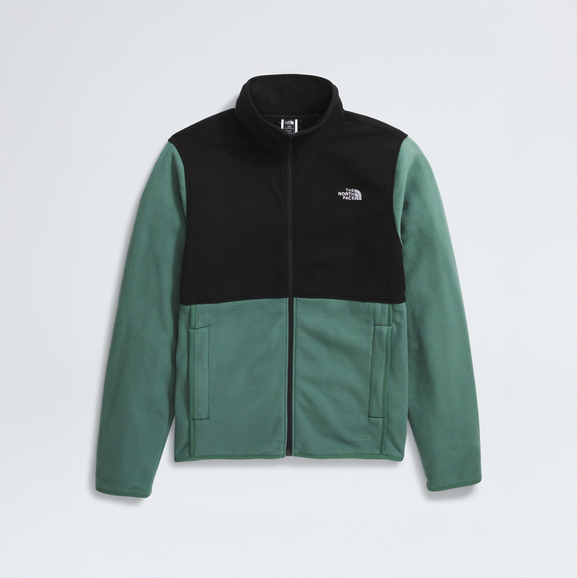 The North Face M Glacier Fleece Jacket features green sleeves and lower body, a black upper chest and shoulders, front zipper, recycled fabric, and a logo on the left chest.