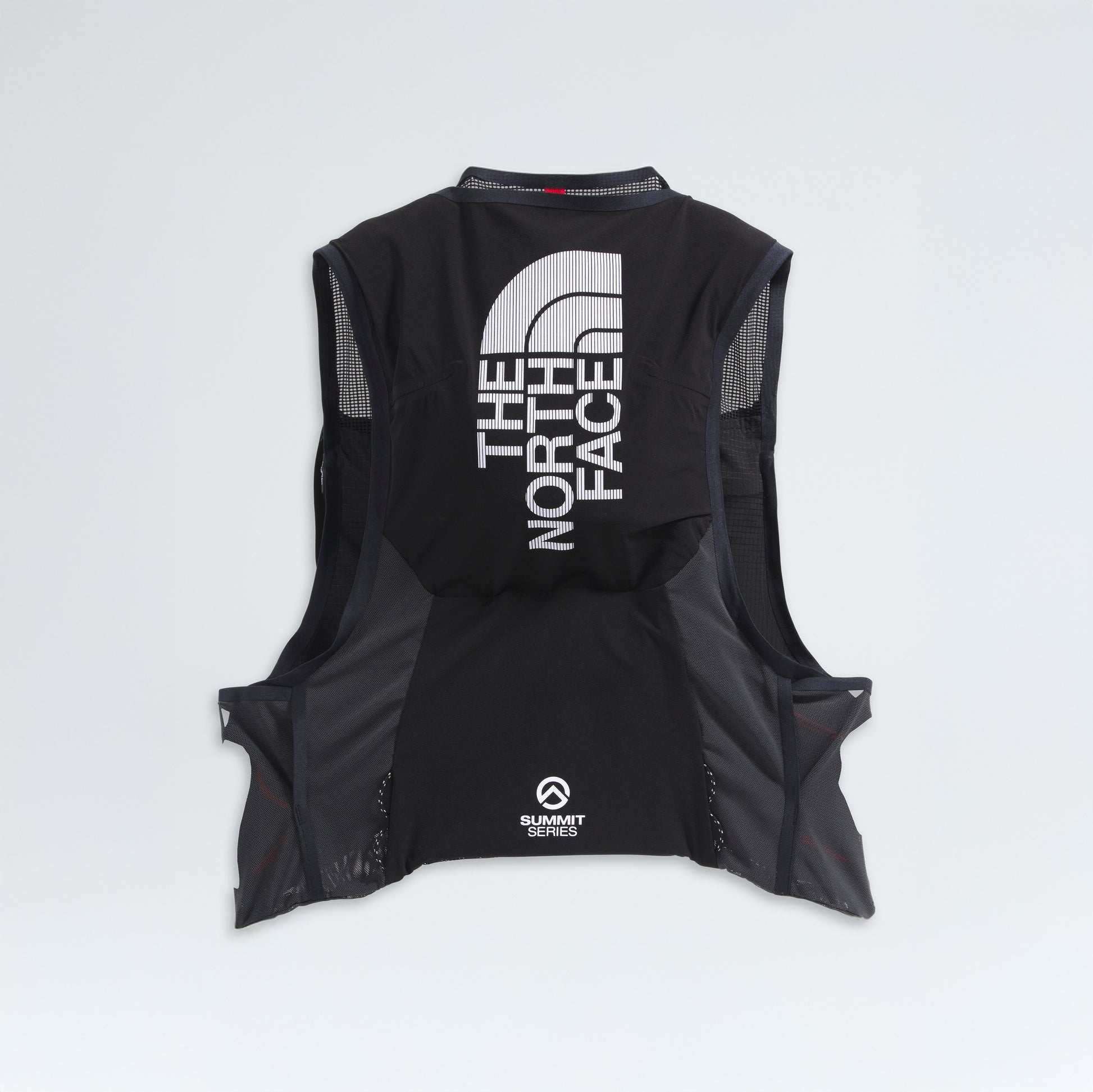 Experience the U Summit Run Vest 5 by The North Face, designed for race day performance with an interior logo and grid pattern highlighted against a crisp white backdrop.