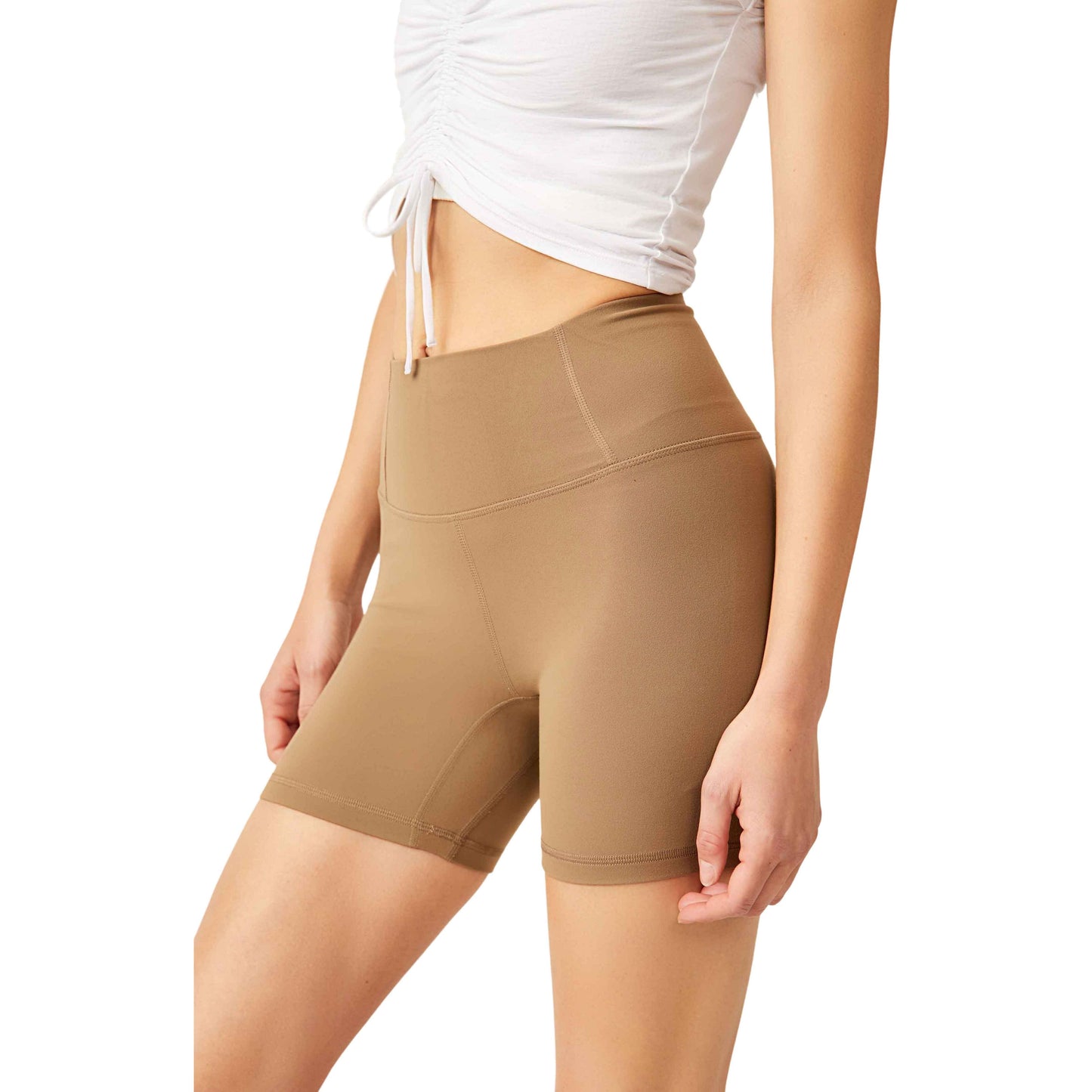 A close-up view of a woman wearing Moonrock high-waisted shapewear shorts and a white tied-up t-shirt, focusing on the mid-section.