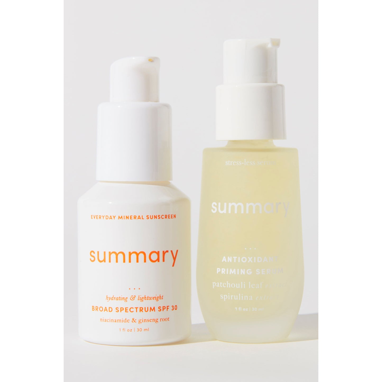 Two skincare bottles labeled "Summary SPF 30," one a mineral-based sunscreen and the other an antioxidant serum, against a white background.