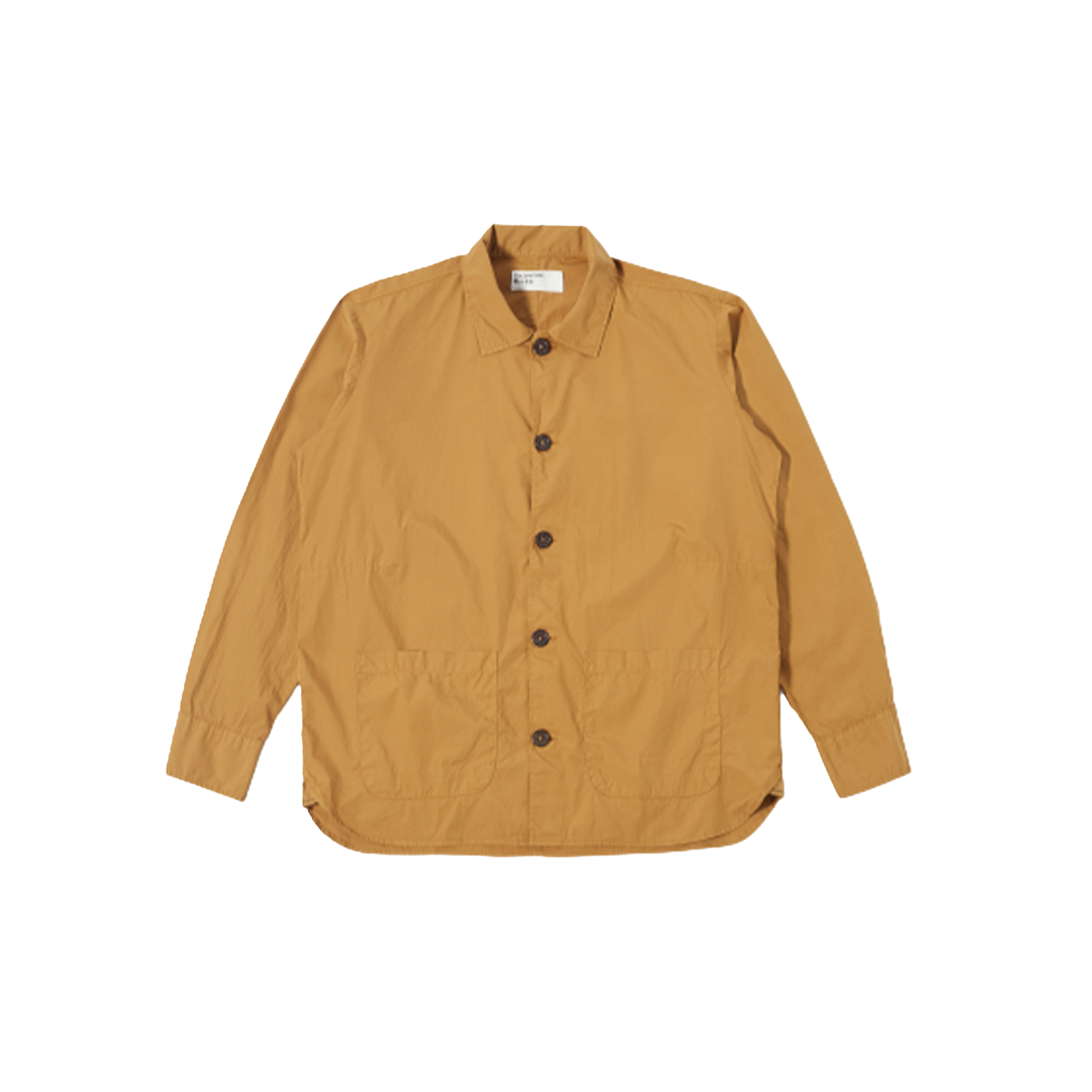 An oversized Travail Shirt in cumin by Universal Works with long sleeves, featuring a collar, two front pockets, and a stylish curved hem, displayed on a plain background.