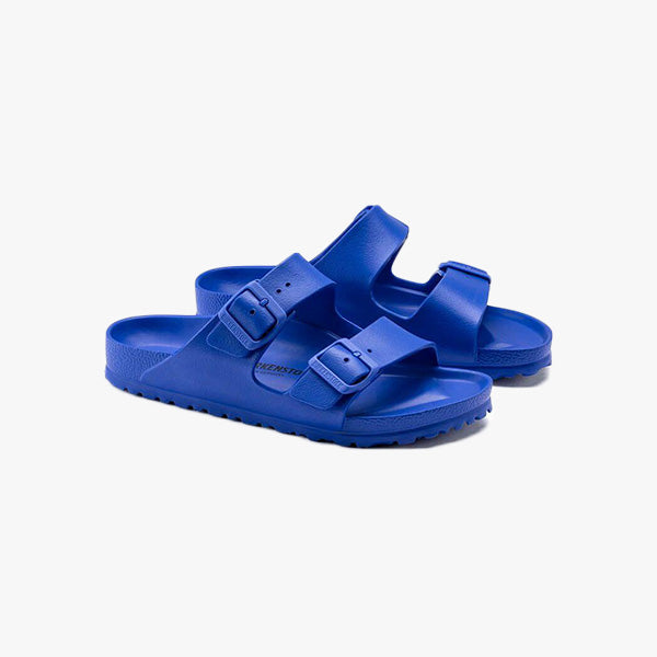 A pair of Birkenstock Arizona EVA Regular sandals in Ultra Blue, featuring two adjustable buckle straps and a signature footbed, displayed on a plain white background.