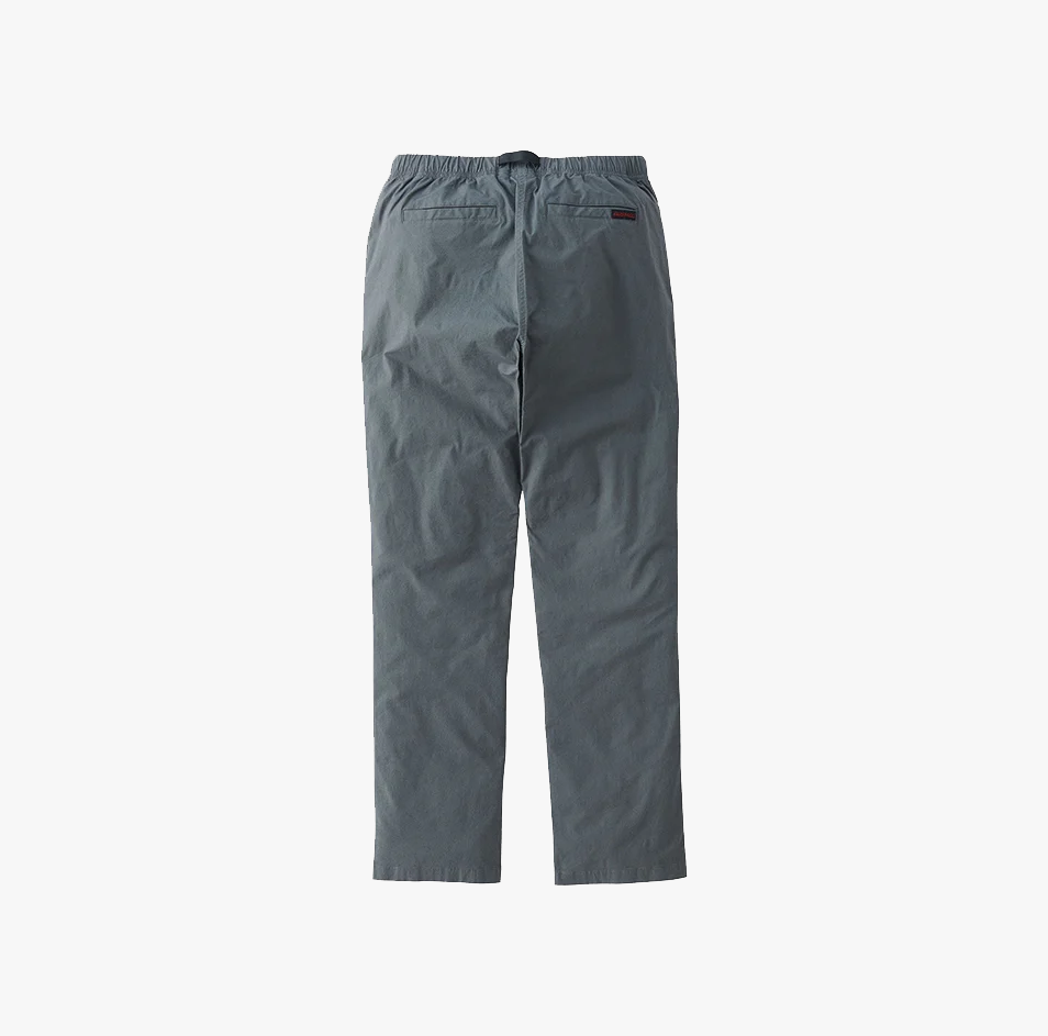 Gramicci Weather NN-Pant in Charcoal, featuring a straight-leg fit, elastic waistband, and two back pockets, shown flat on a white background.
