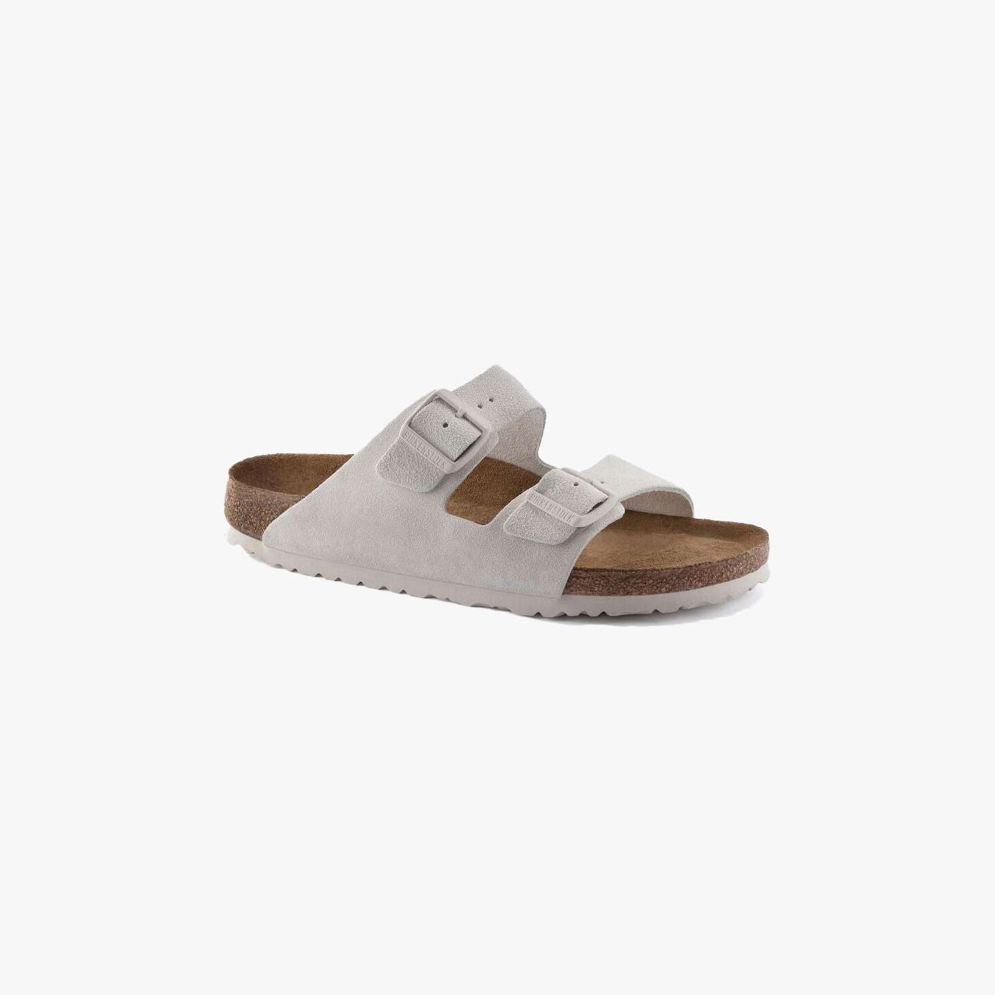 The Birkenstock Arizona SFB in Antique White features two adjustable buckled straps, a contoured cork footbed for support, and a white rubber sole, displayed against a plain white background.