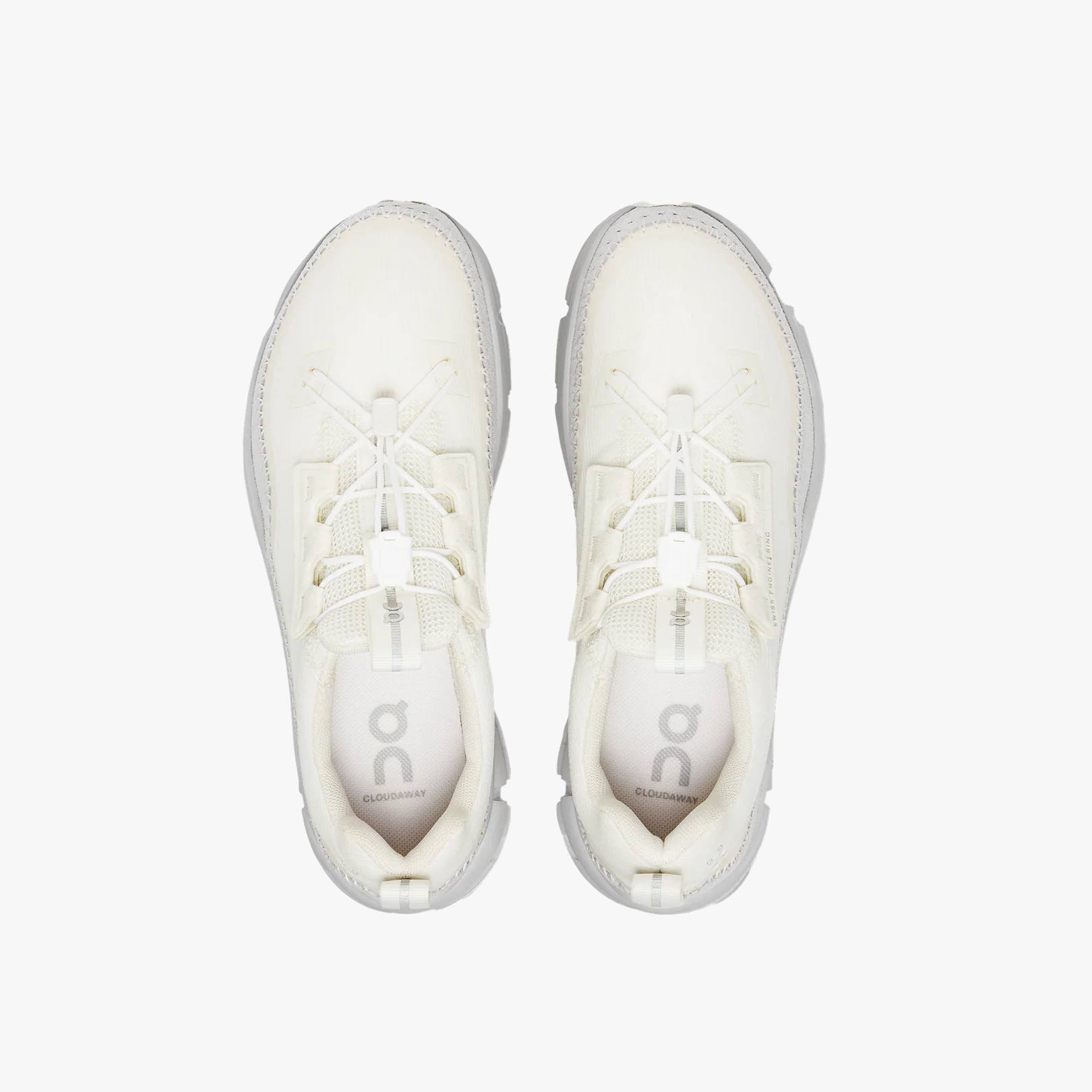 Top view of a pair of Women's Cloudaway by On Running in off-white, featuring ultra-lightweight mesh details, elastic laces, and a signature CloudTec sole on a plain white background.