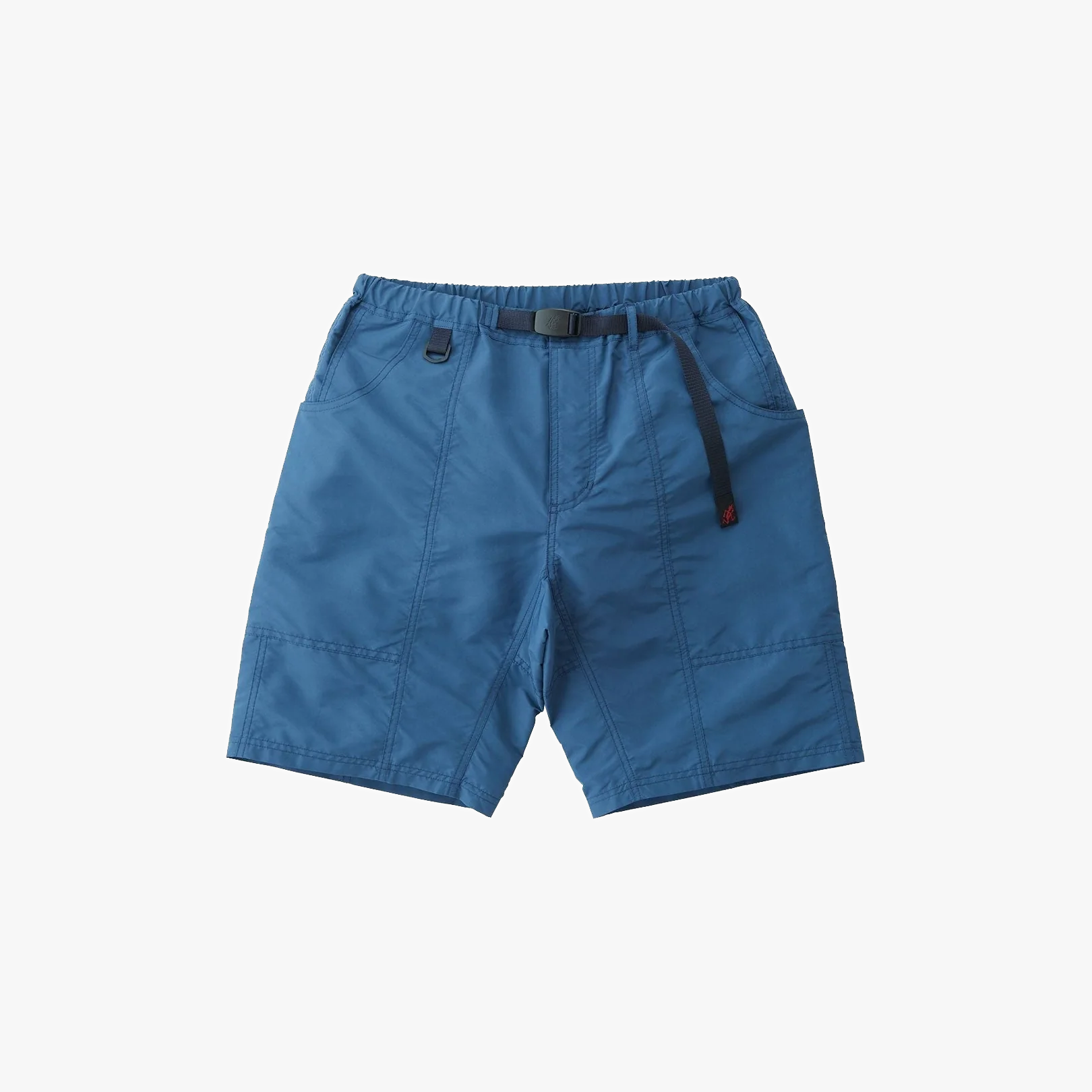 The Gramicci Shell Gear Short in navy is a high-performance outdoor short made of blue nylon with an elastic waistband, integrated belt, side pockets, and visible stitching—ideal for hiking and outdoor activities.
