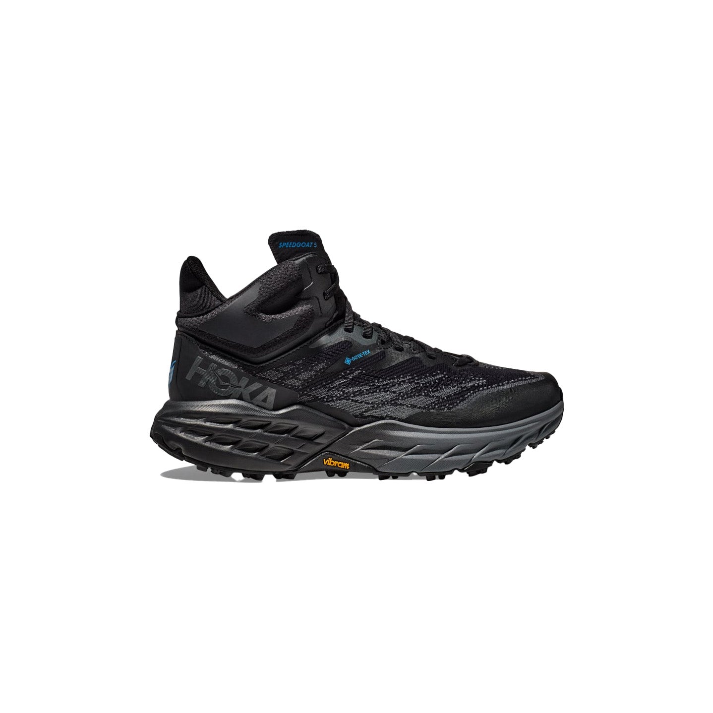 A Hoka M Speedgoat 5 Mid GTX trail running shoe in black, featuring a mesh upper, rugged Vibram Megagrip sole, and "Speedgoat" label near the ankle, shown from the side against a white background.