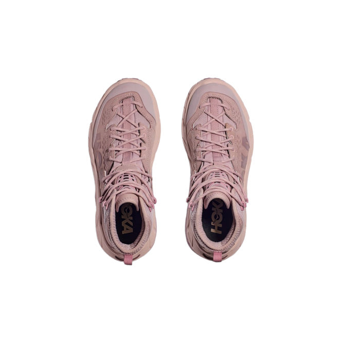 A pair of Hoka U Tor Ultra Hi shoes in Pale Mauve/Peach Whip, viewed from above with tied laces and visible logo on the insoles.