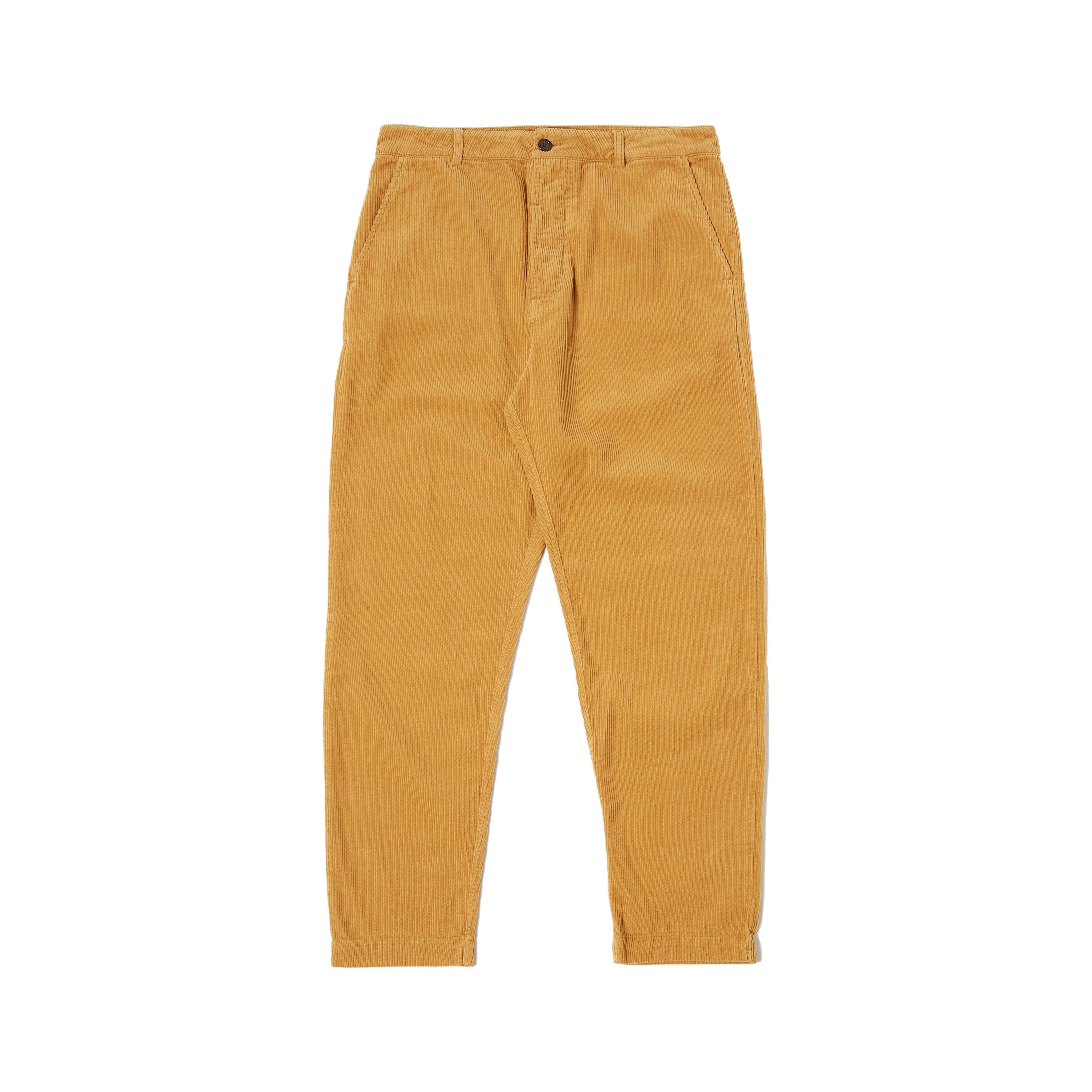 Universal Works' Military Chino Corduroy in Corn features a relaxed fit with front button and zipper, mid-rise design, and two side pockets, making these military-inspired trousers perfect for any casual outing.