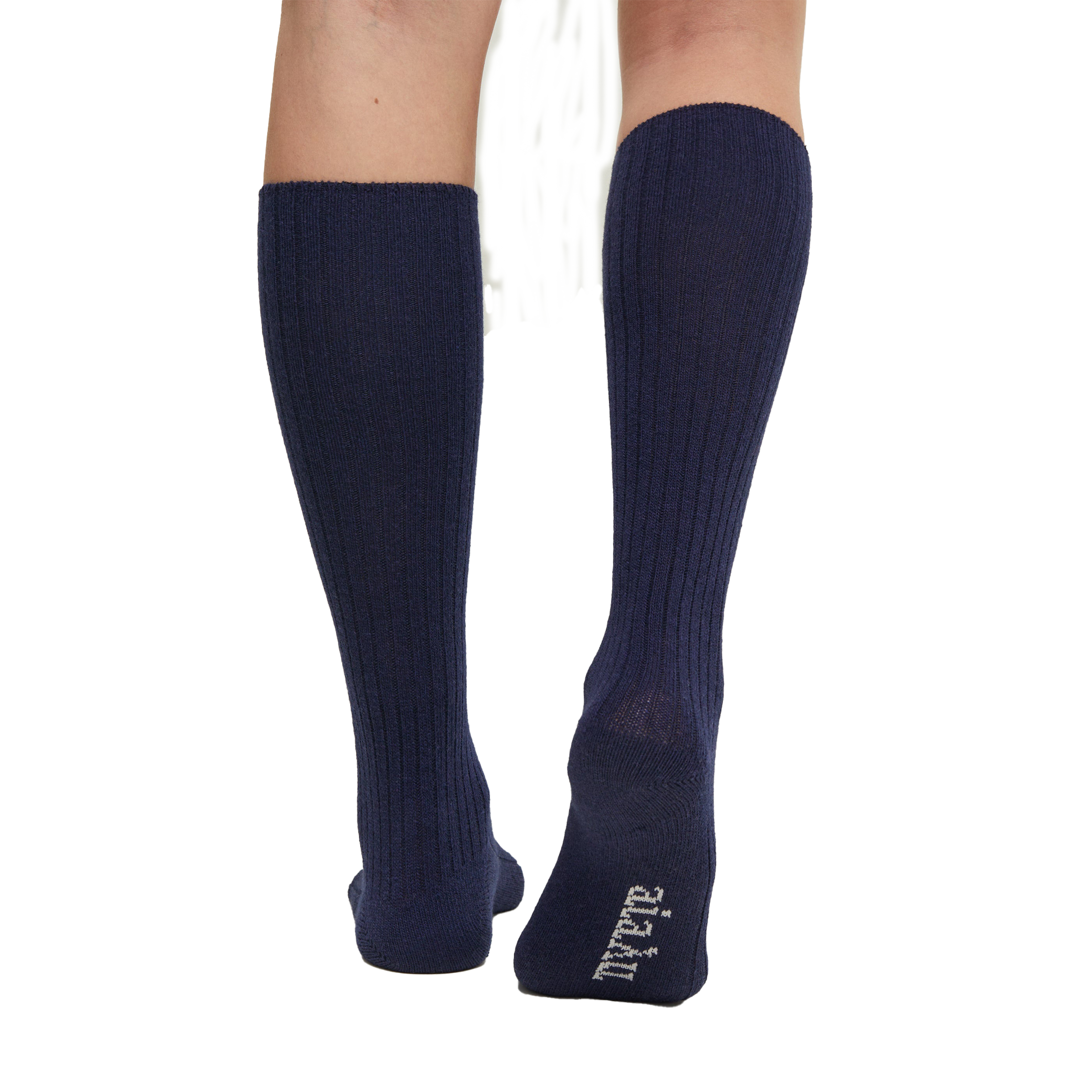 A person wears Aiayu's Wool Knee Socks in navy blue, featuring white text on one heel. These durable knit socks offer long-lasting comfort.