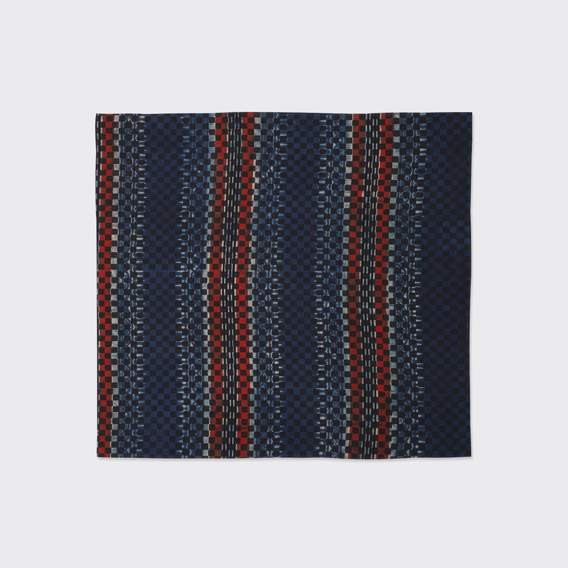 The Kardo Bandana 21" x 21", Ajrakh 22 features a square fabric with vertical blue, red, and black stripes, plus geometric and checkered patterns.