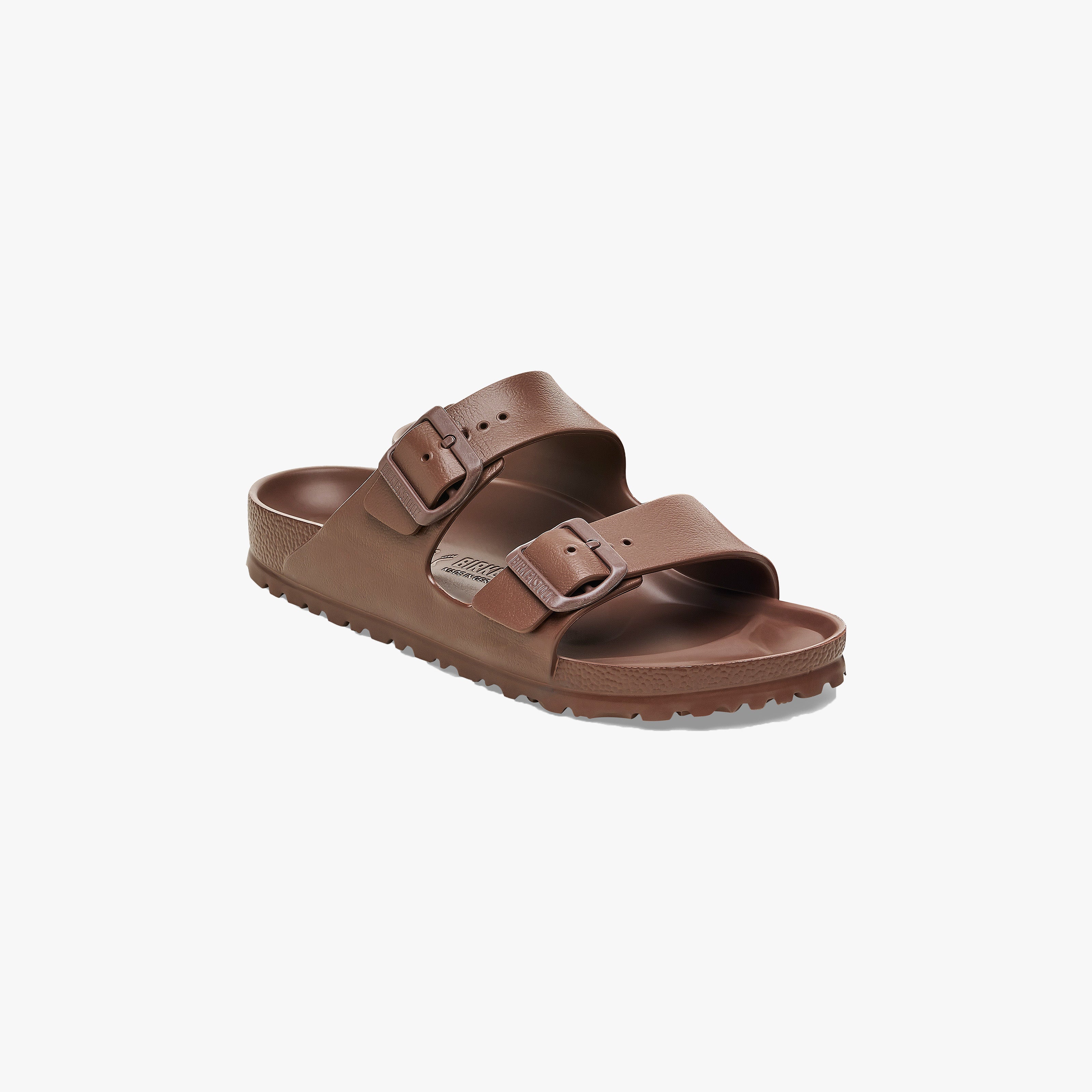 The Birkenstock Arizona EVA Narrow in Roast is a brown sandal with two adjustable buckle straps, an ergonomic footbed, and a textured sole—stylish and water-friendly for daily wear. Shown on a plain white background.