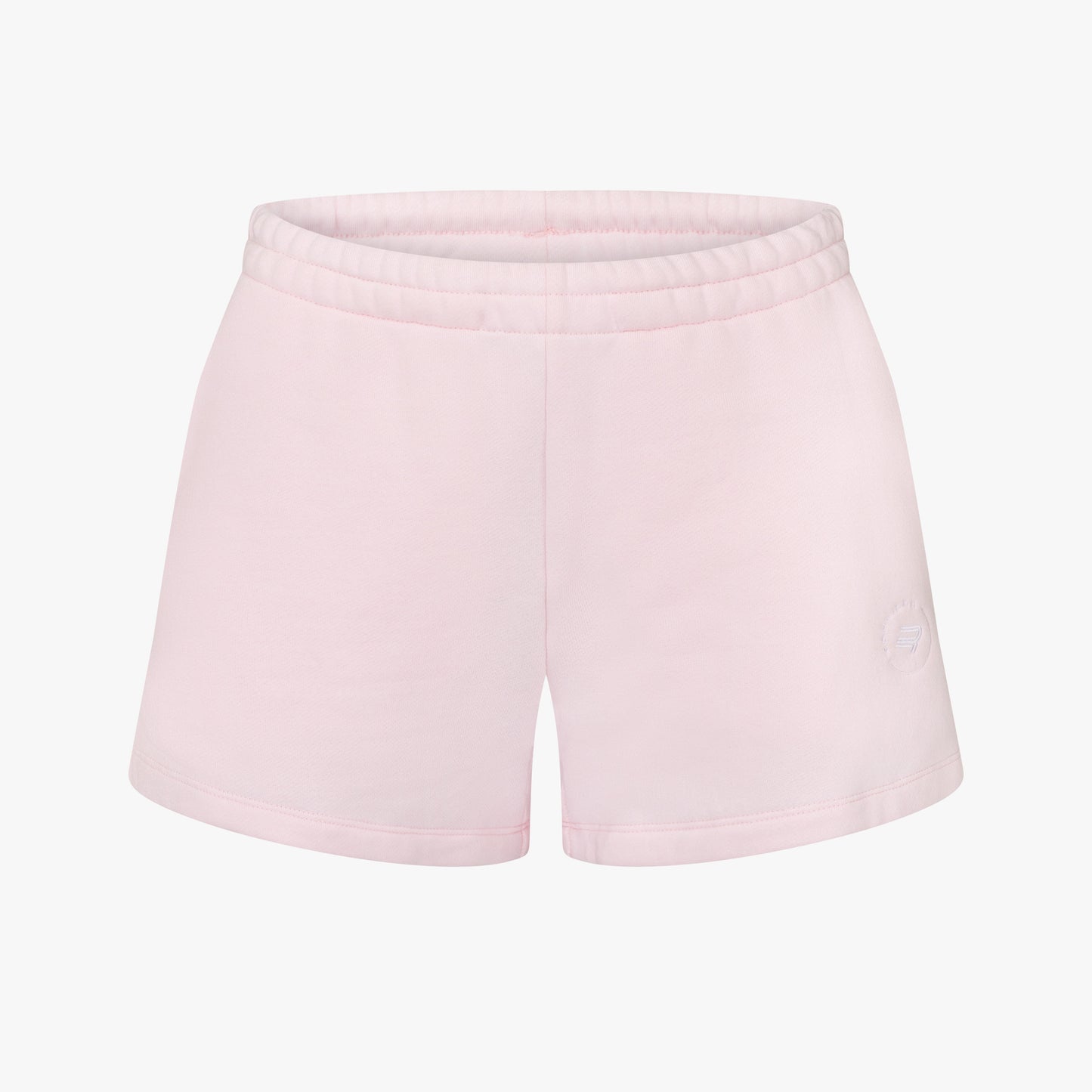Rohnisch's Soft Sweatshorts in light pink are crafted from soft Terry fabric and feature an elastic waistband with a subtle logo print on a plain white background.