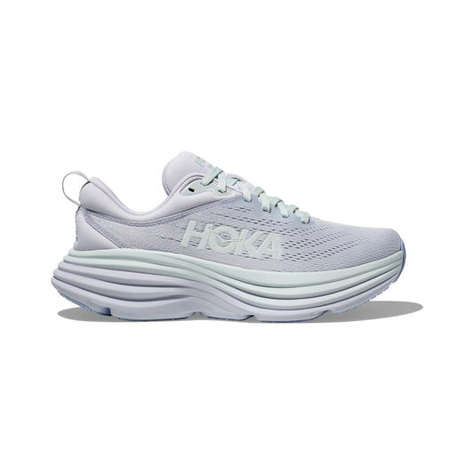 The W Bondi 8 sneaker by Hoka, in Ether/Illusion, features a thick cushioned sole for a balanced ride and a breathable mesh upper showcasing the signature "HOKA" branding.
