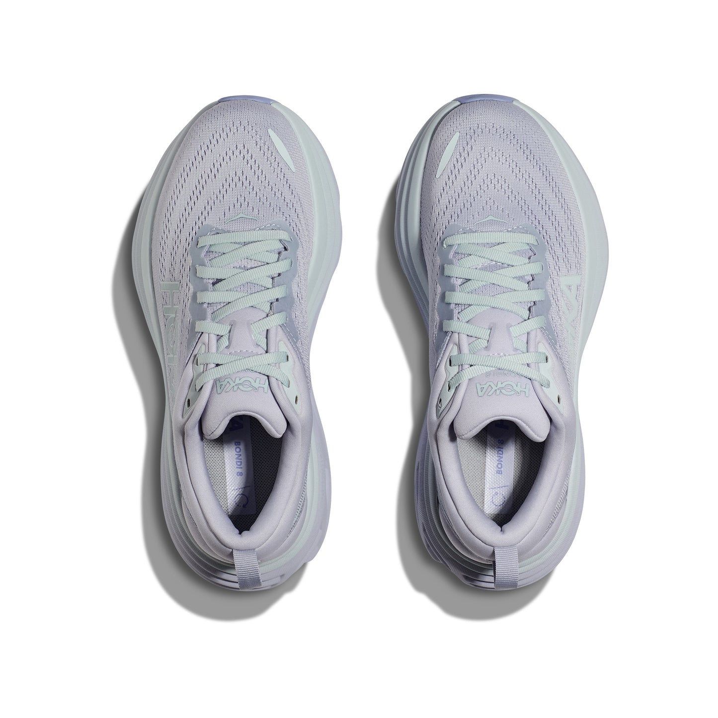 The Hoka W Bondi 8 in Ether/Illusion features light purple hues and white laces on a white background, offering a soft, balanced ride.