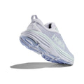 The W Bondi 8 by Hoka in Ether/Illusion color features a thick sole for a soft, balanced ride. "Hoka" is prominently displayed on the side against a light gray background.