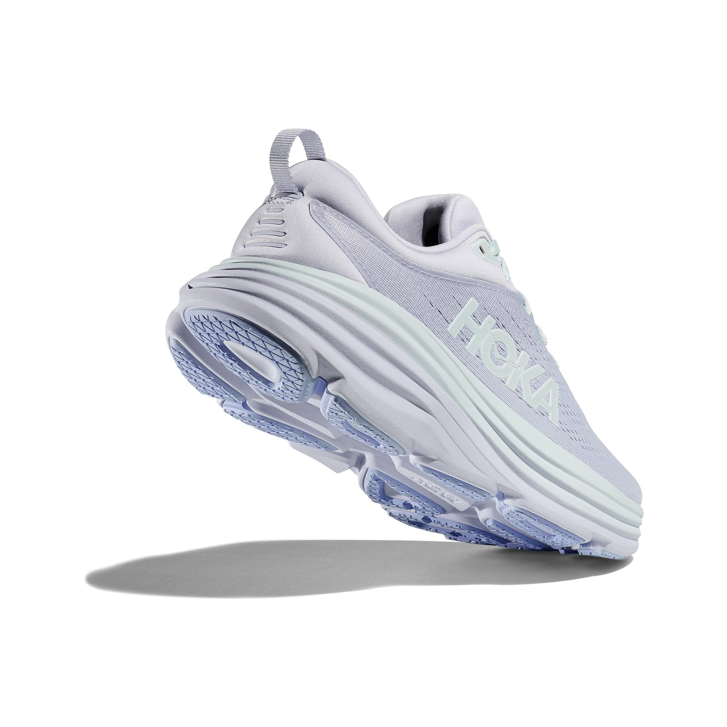 The W Bondi 8 by Hoka in Ether/Illusion color features a thick sole for a soft, balanced ride. "Hoka" is prominently displayed on the side against a light gray background.
