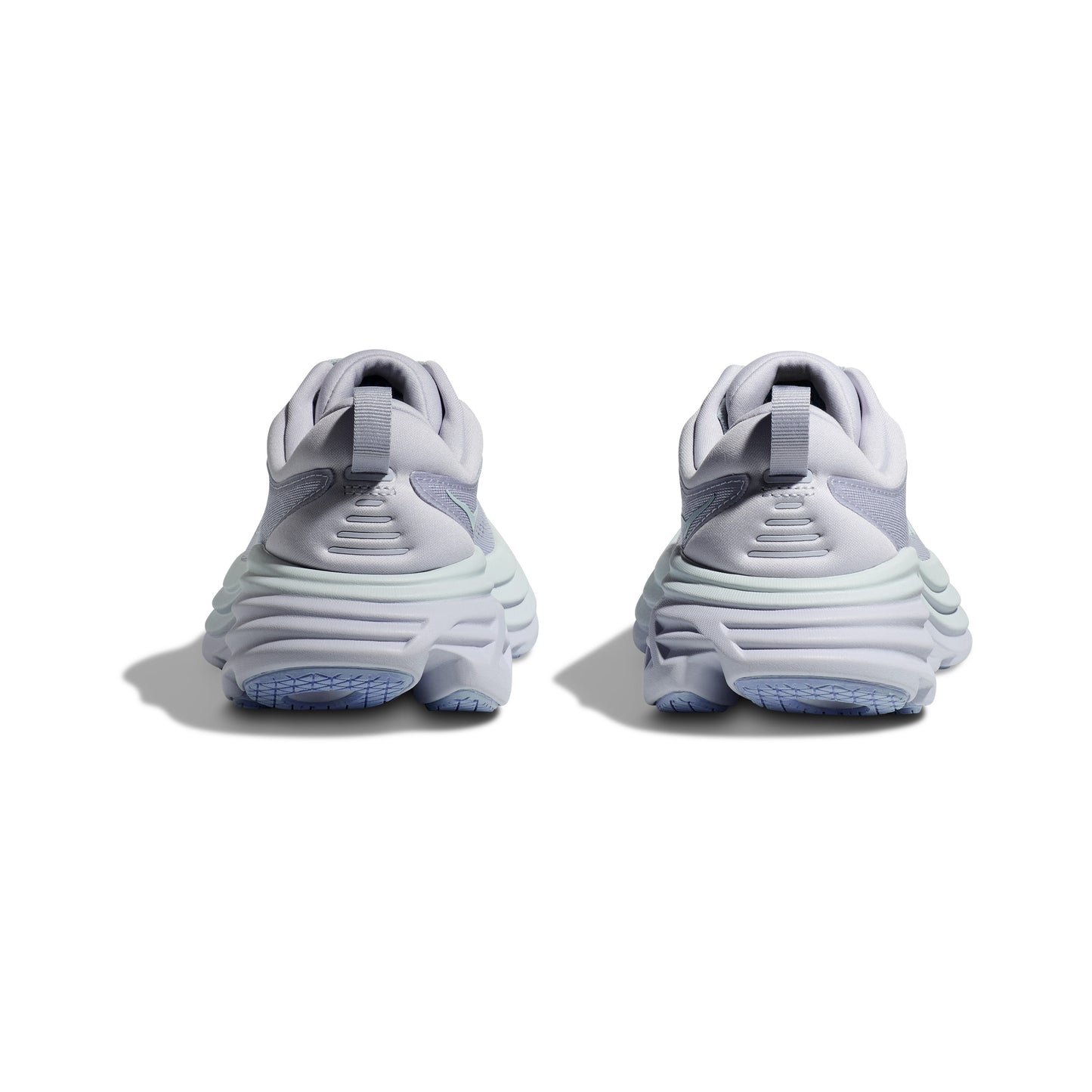 Rear view of Hoka W Bondi 8 sneakers in Ether/Illusion, featuring thick, cushioned soles for a soft and balanced ride with light blue accents on the outsoles, isolated on a white background.