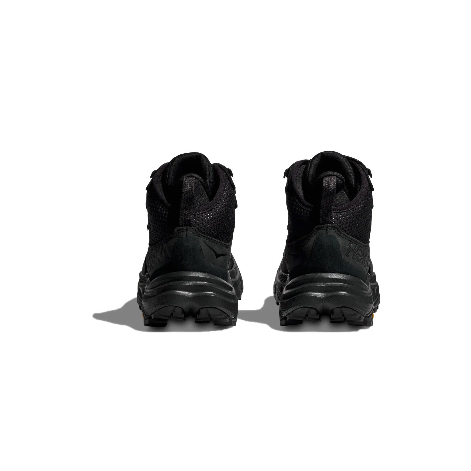 A pair of Hoka W Anacapa MID GTX sneakers in black/black, shown from the back against a white background.