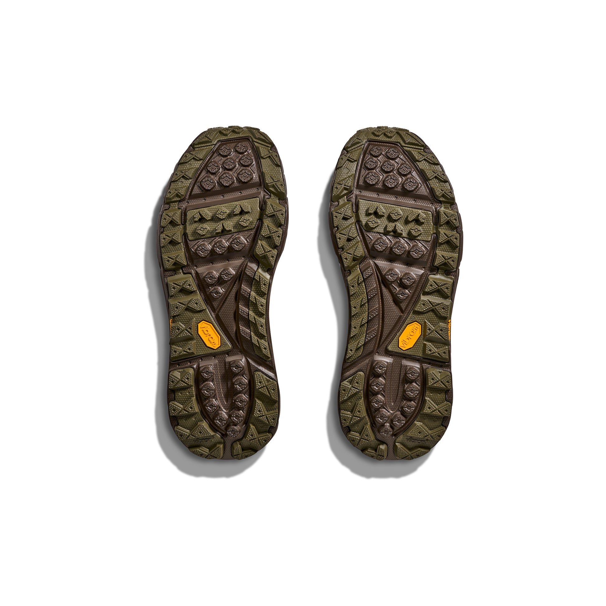 The U Tor Summit TP soles by Hoka are olive and brown, ideal for workwear or hiking boots, with a unique pattern and vibrant orange accents. Enhanced with HOKA cushioning, they offer comfort and durability against a crisp white background.