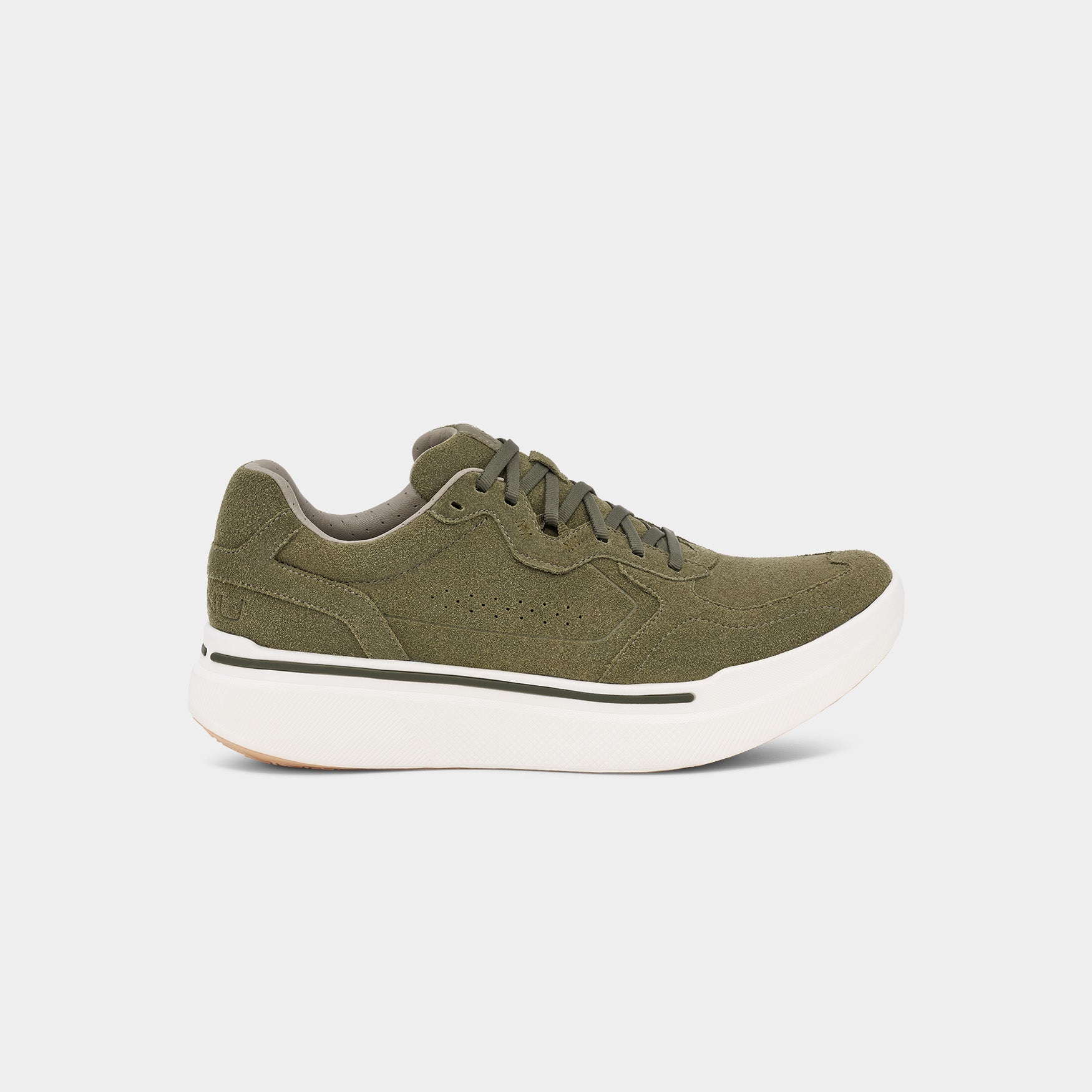 The AHNU M Sequence 1.1 Suede sneaker, viewed from the side against a plain white background, features a green upper with dark green laces, a premium foam insole, and a thick white sole.