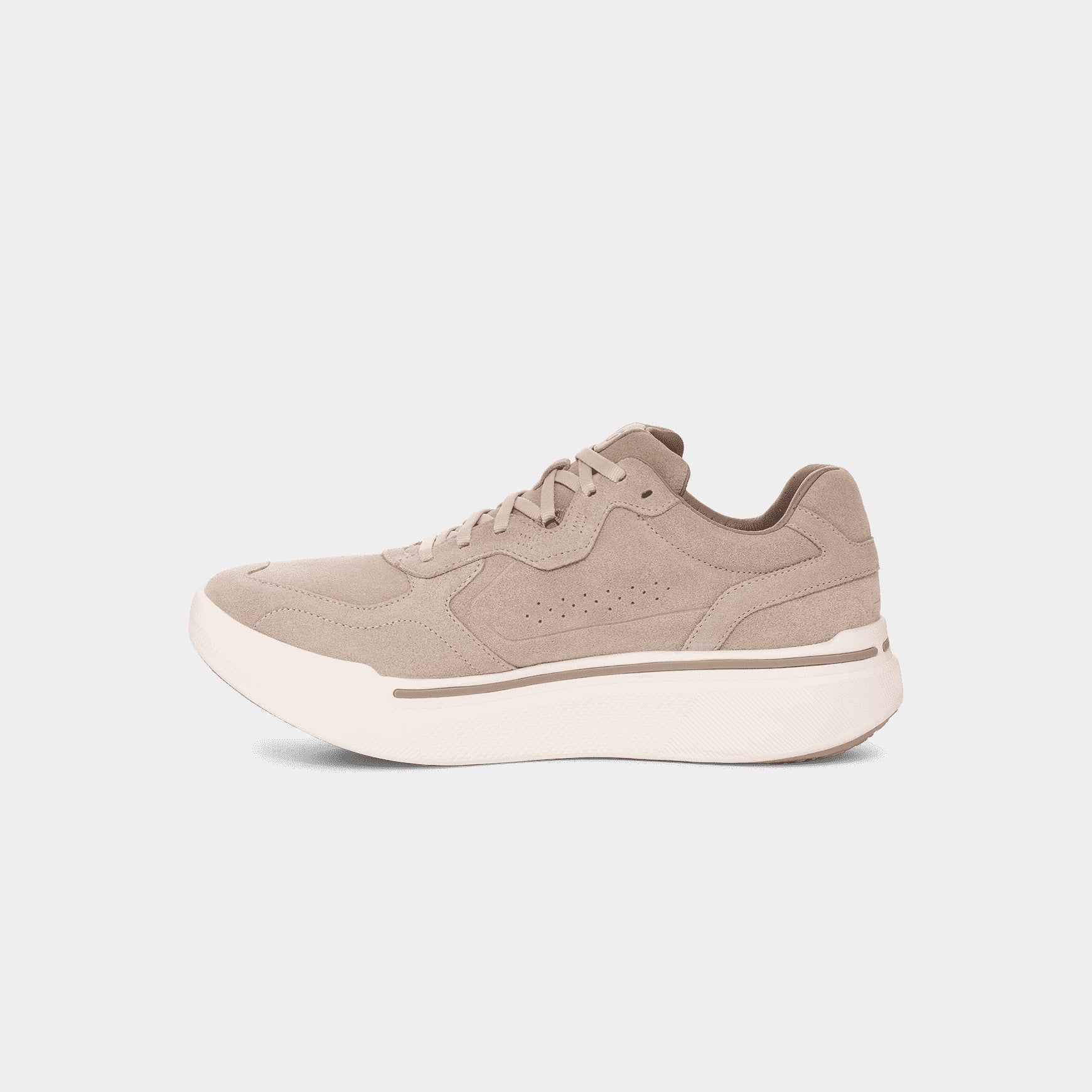 The M Sequence 1.1 Suede by AHNU features a beige upper with perforated detailing, a white sole, and a lace-up design. Enhanced with premium foam cushioning for superior comfort, it's shown from the side.