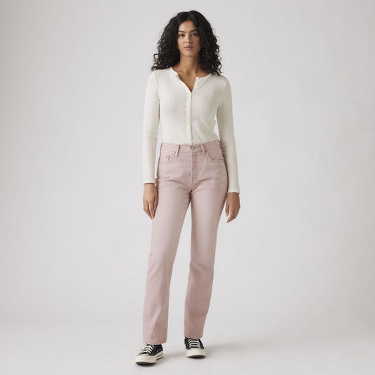 A person stands facing forward wearing a white long-sleeve top, Levis 501 Original Scraped Pale Mauve straight fit jeans, and black-and-white sneakers against a plain light background.