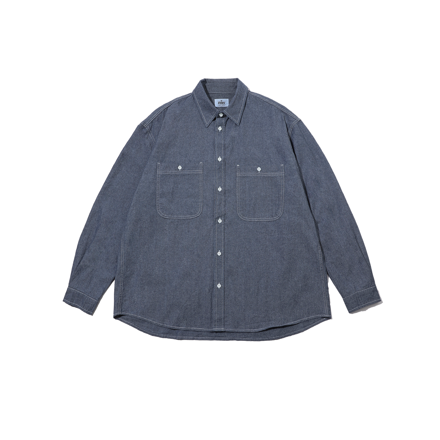 The Kappy 2 Pocket Denim Shirt is a unisex, blue, 100% cotton piece featuring a button-up design with a collar and two chest pockets against a white background.