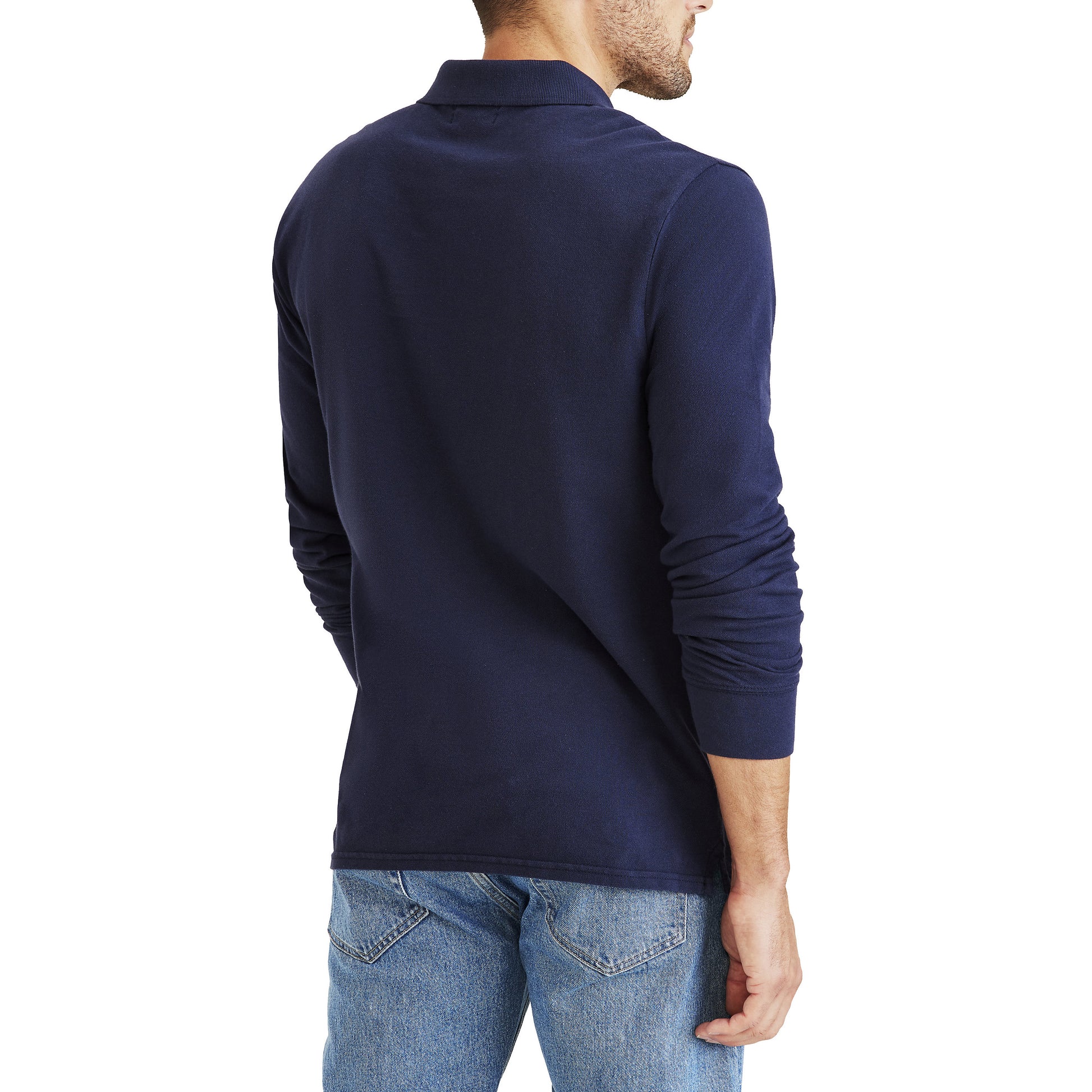 A man is shown from the back, standing against a white background, wearing Dockers Men's Pique Polo, LS in slim fit with a no roll collar and long sleeves, paired with blue jeans.