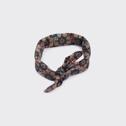 Kardo’s Bandana 21" x 21", Ajrakh 23 features a knotted front and a floral pattern in brown, blue, and red tones, shown against a plain light background.