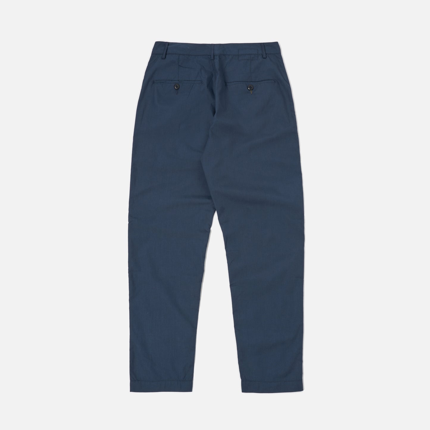 Universal Works Recycled Poly Tech Military Chino in navy, shown flat from the back, features two buttoned rear pockets and belt loops.