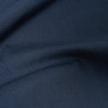 A close-up of the Universal Works Recycled Poly Tech Military Chino in Navy, highlighting its dark blue fabric, smooth texture, and visible folds.