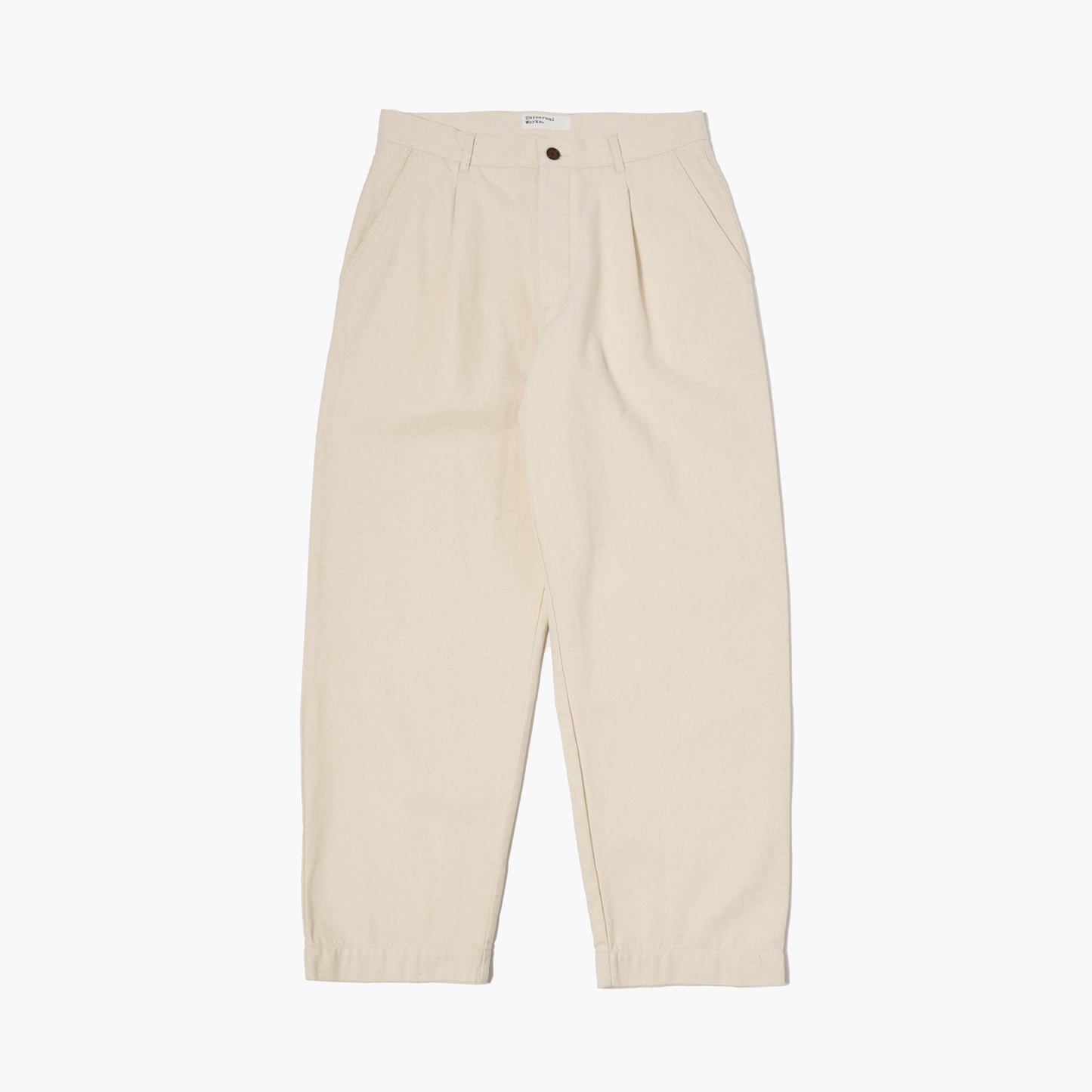 The Universal Works Recycled Cotton Duke Pant in Ecru features a high waist, pleated front, straight legs, button and zip closure, and front pockets, shown laid flat on a white background.