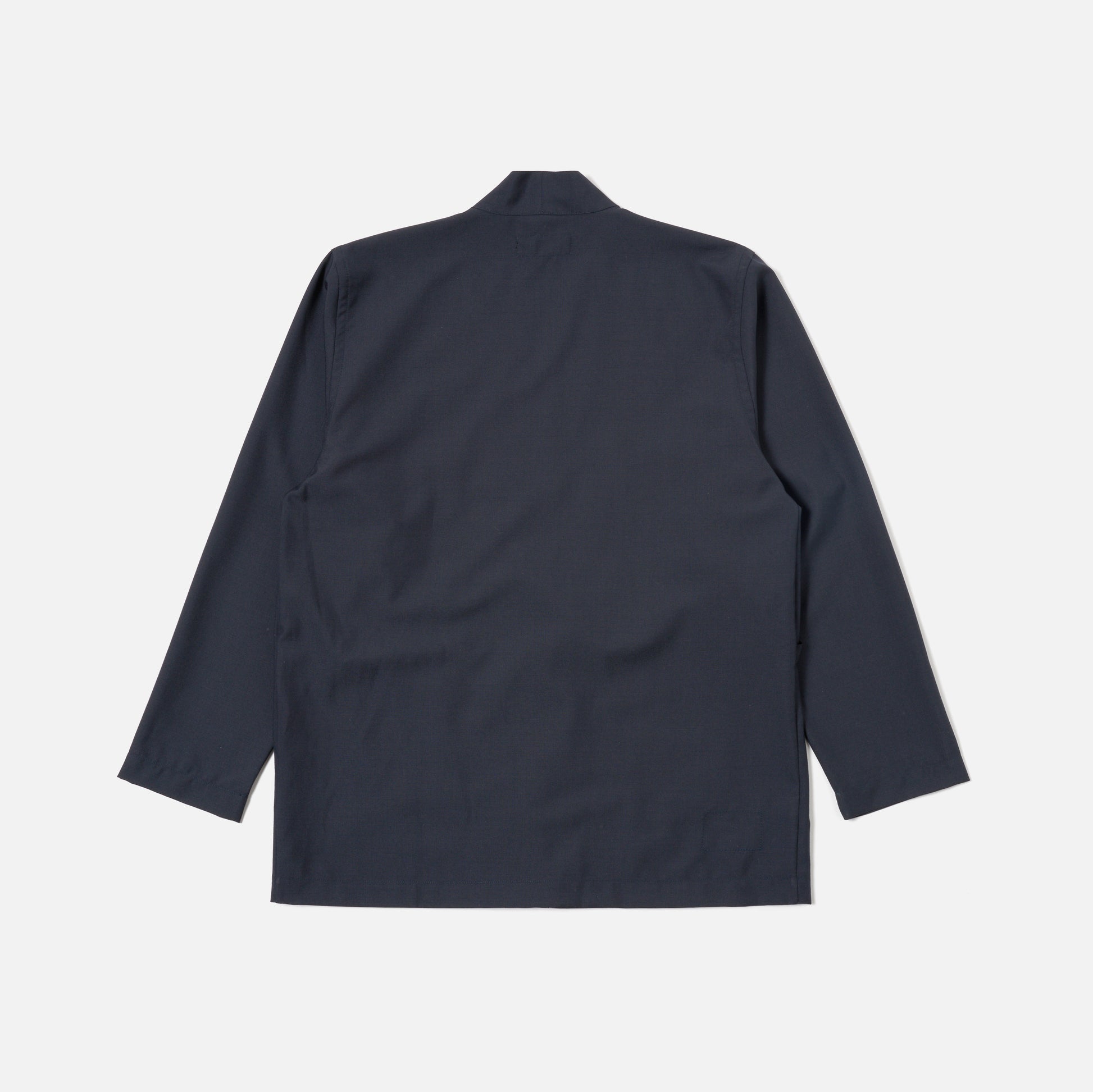 The Universal Works Tropical Suiting Kyoto Work Jacket in navy is shown laid flat with the back view visible against a plain white background.