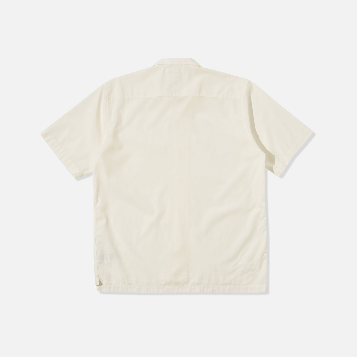 The Universal Works Gardenia Lycot Camp Shirt in Ecru is displayed flat, back side up, against a white background.