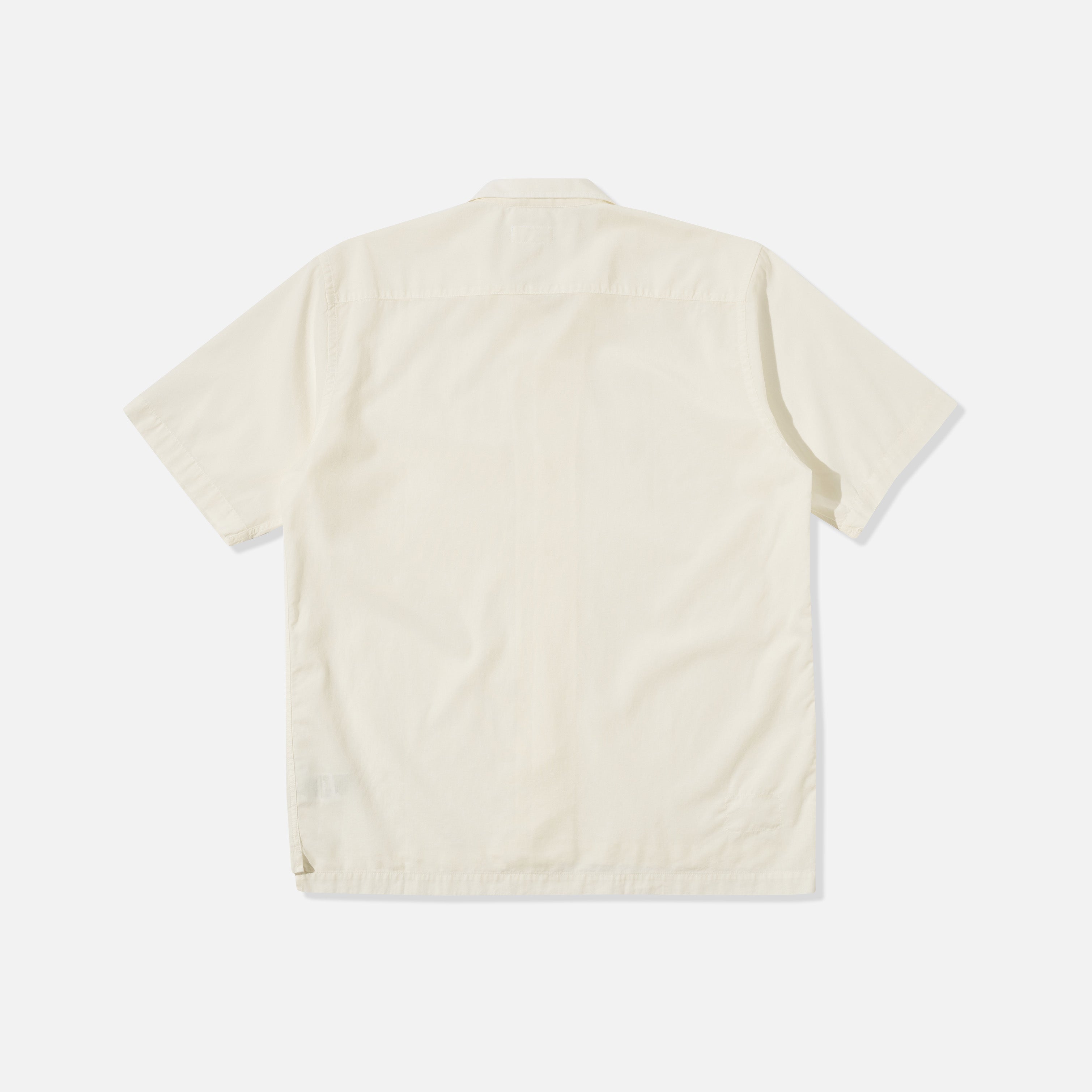 The Universal Works Gardenia Lycot Camp Shirt in Ecru is displayed flat, back side up, against a white background.